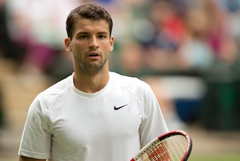 Jun 25, 2014; London, United Kingdom; Grigor Dimitrov (BUL) during his match against  Luke Saville (AUS) on day three of the 2014 Wimbledon Championships at the All England Lawn and Tennis Club. Mandatory Credit: Susan Mullane-USA TODAY Sports