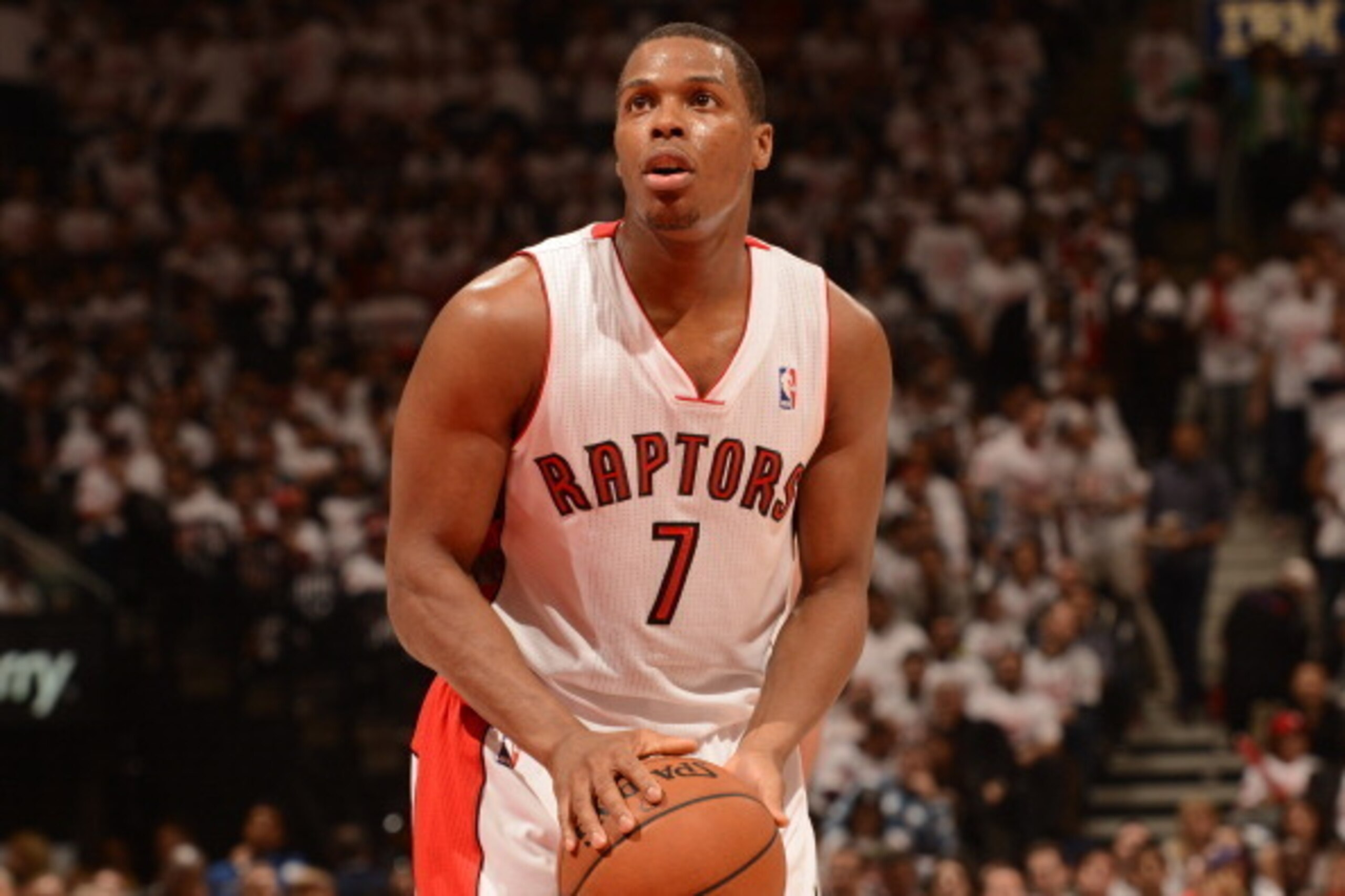 TORONTO, CANADA - April 19: Kyle Lowry #7 of the Toronto Raptors attempts a free throw against the Brooklyn Nets  during Game One of the Eastern Conference Quarterfinals of the 2014 NBA playoffs on April 19, 2014 at the Air Canada Centre in Toronto, Ontar