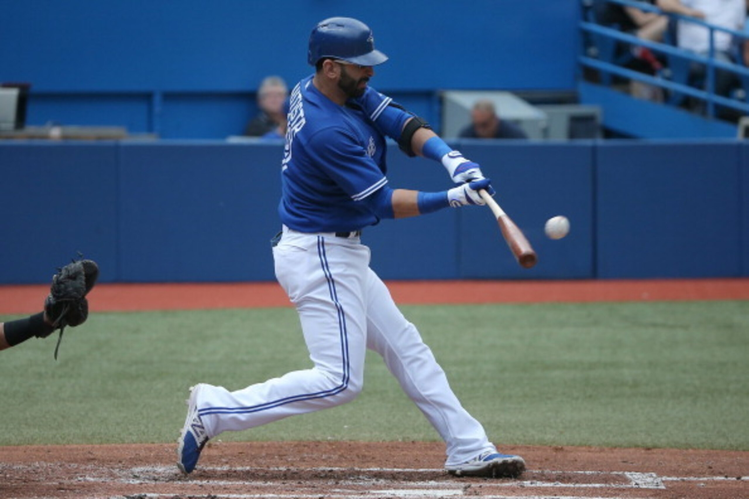 TORONTO, CANADA - JULY 2: Jose Bautista #19 of the Toronto Blue Jays hits a solo home run in the first inning during MLB game action against the Milwaukee Brewers on July 2, 2014 at Rogers Centre in Toronto, Ontario, Canada. (Photo by Tom Szczerbowski/Get