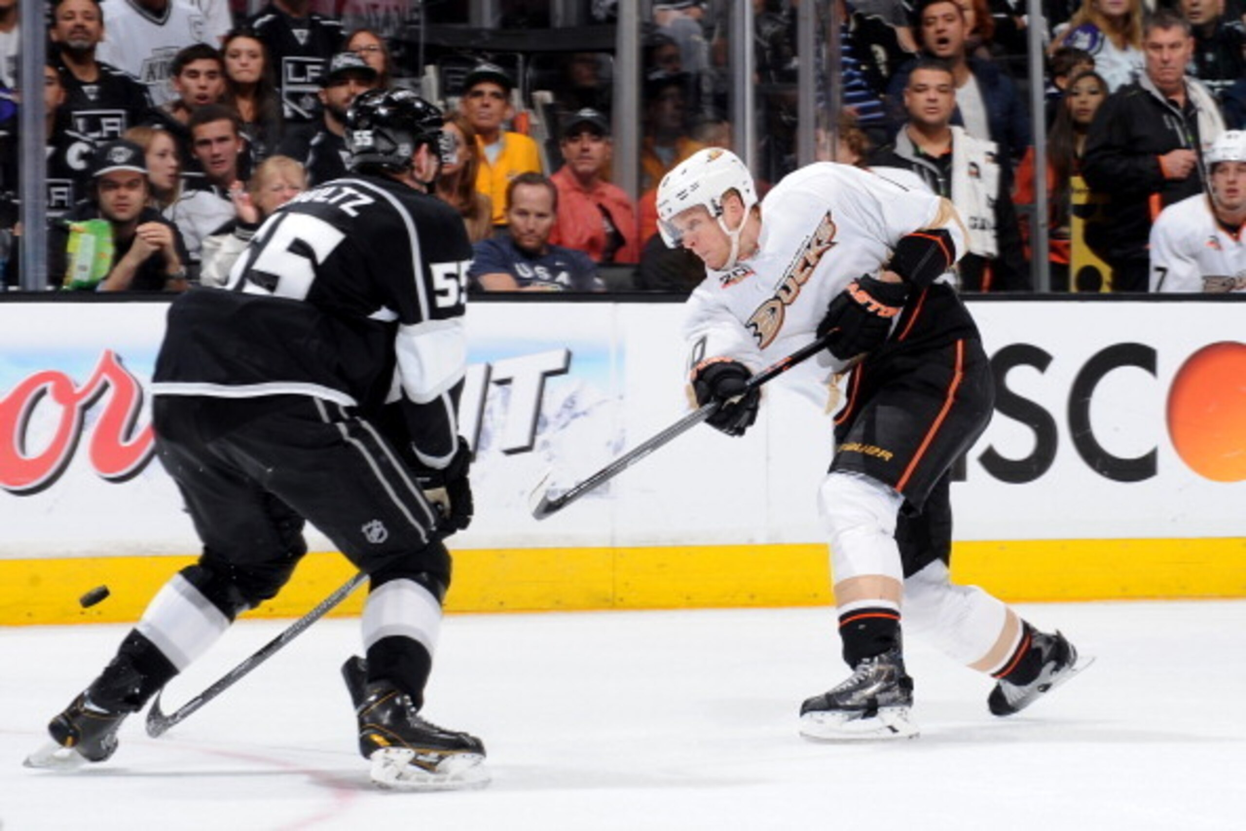 LOS ANGELES, CA - MAY 10:  Corey Perry #10 of the Anaheim Ducks shoots the puck against Jeff Schultz #55 of the Los Angeles Kings in Game Four of the Second Round of the 2014 Stanley Cup Playoffs at Staples Center on May 10, 2014 in Los Angeles, Californi