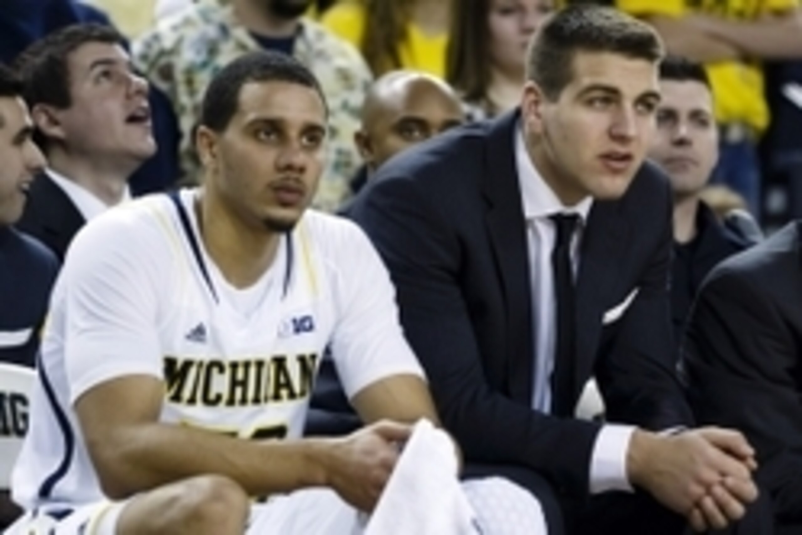 Dec 28, 2013; Ann Arbor, MI, USA; Michigan Wolverines forward Jordan Morgan (52) and forward Mitch McGary (4) sit on the bench in the second half against the Holy Cross Crusaders at Crisler Arena. Michigan won 88-66. Mandatory Credit: Rick Osentoski-USA T