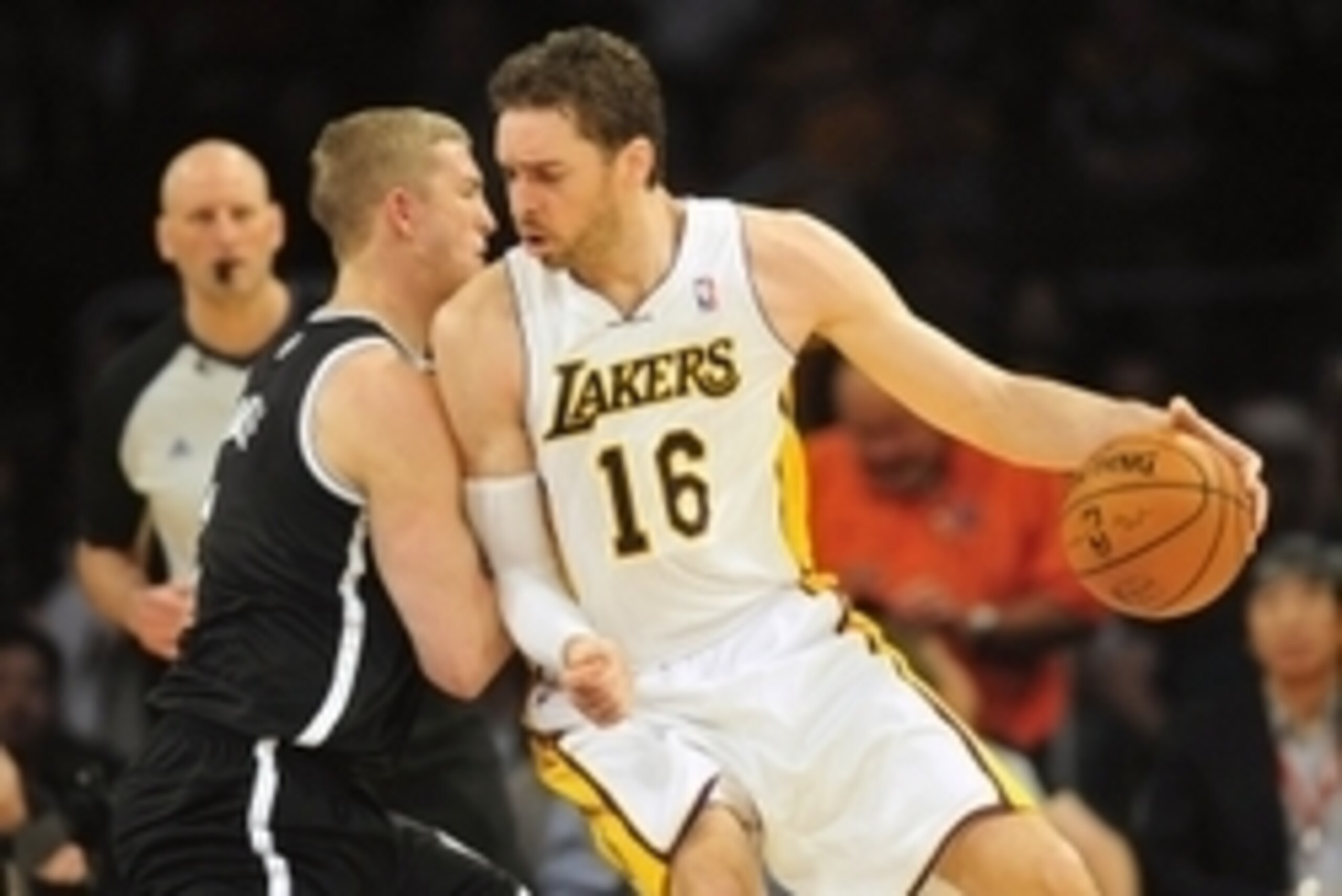 February 23, 2014; Los Angeles, CA, USA; Los Angeles Lakers center Pau Gasol (16) moves the ball against Brooklyn Nets power forward Mason Plumlee (1) during the first half at Staples Center. Mandatory Credit: Gary A. Vasquez-USA TODAY Sports