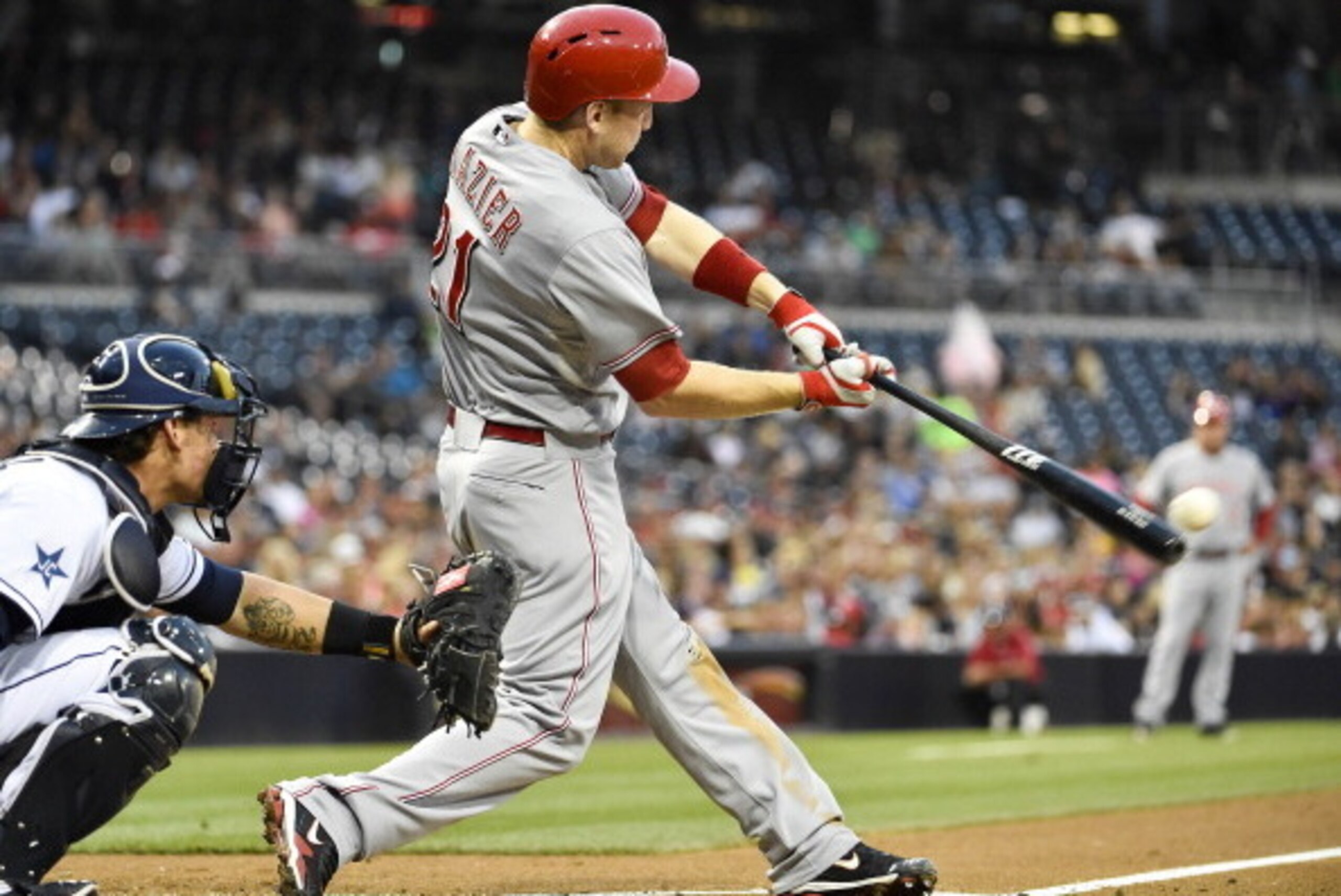 SAN DIEGO, CA - JUNE 30:  Todd Frazier #21 of the Cincinnati Reds hits a single during the third inning of a baseball game against the San Diego Padres at Petco Park June 30, 2014 in San Diego, California.  (Photo by Denis Poroy/Getty Images)