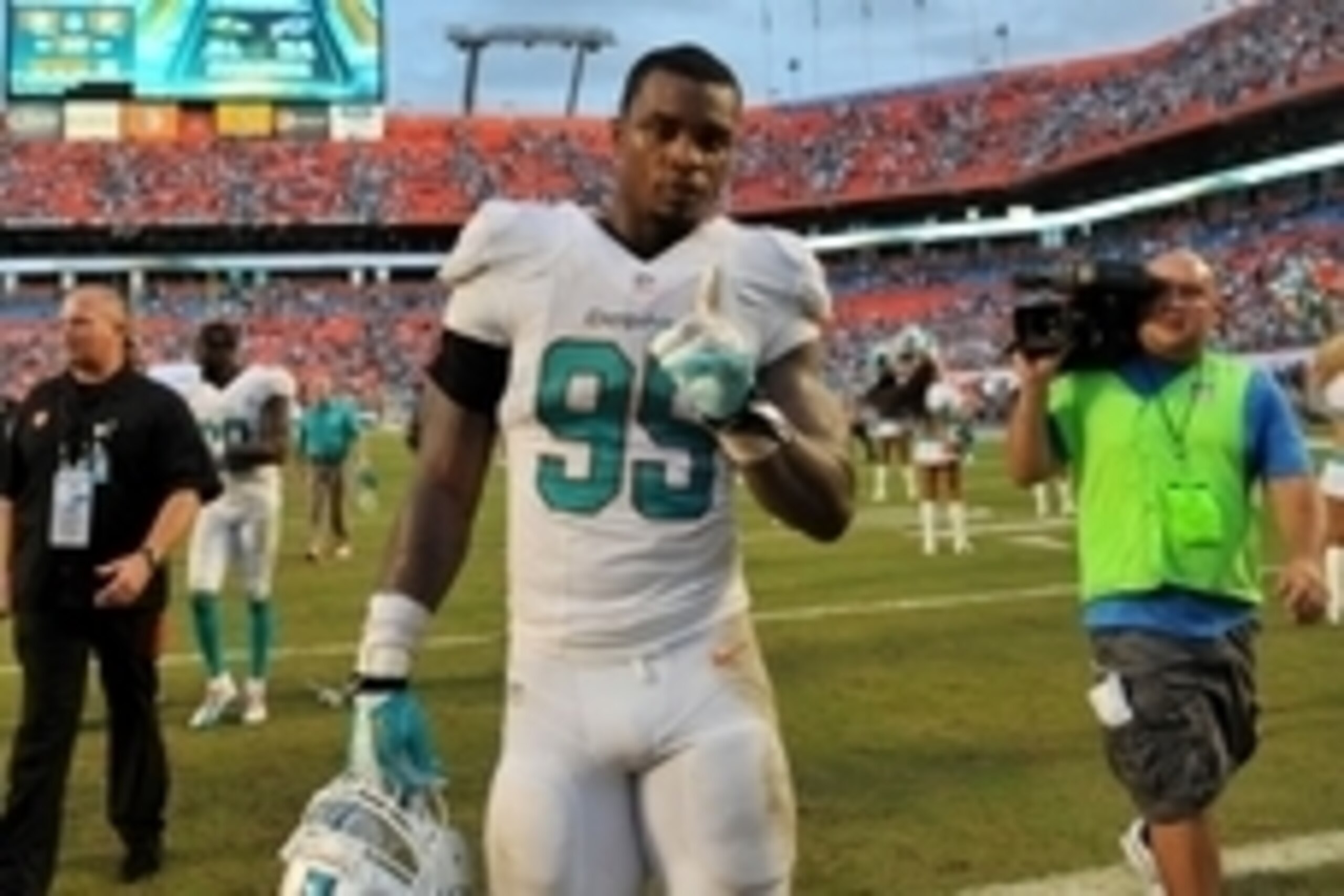 Sep 22, 2013; Miami Gardens, FL, USA; Miami Dolphins defensive end Dion Jordan (95) reacts after defeating the Atlanta Falcons at Sun Life Stadium. Mandatory Credit: Steve Mitchell-USA TODAY Sports