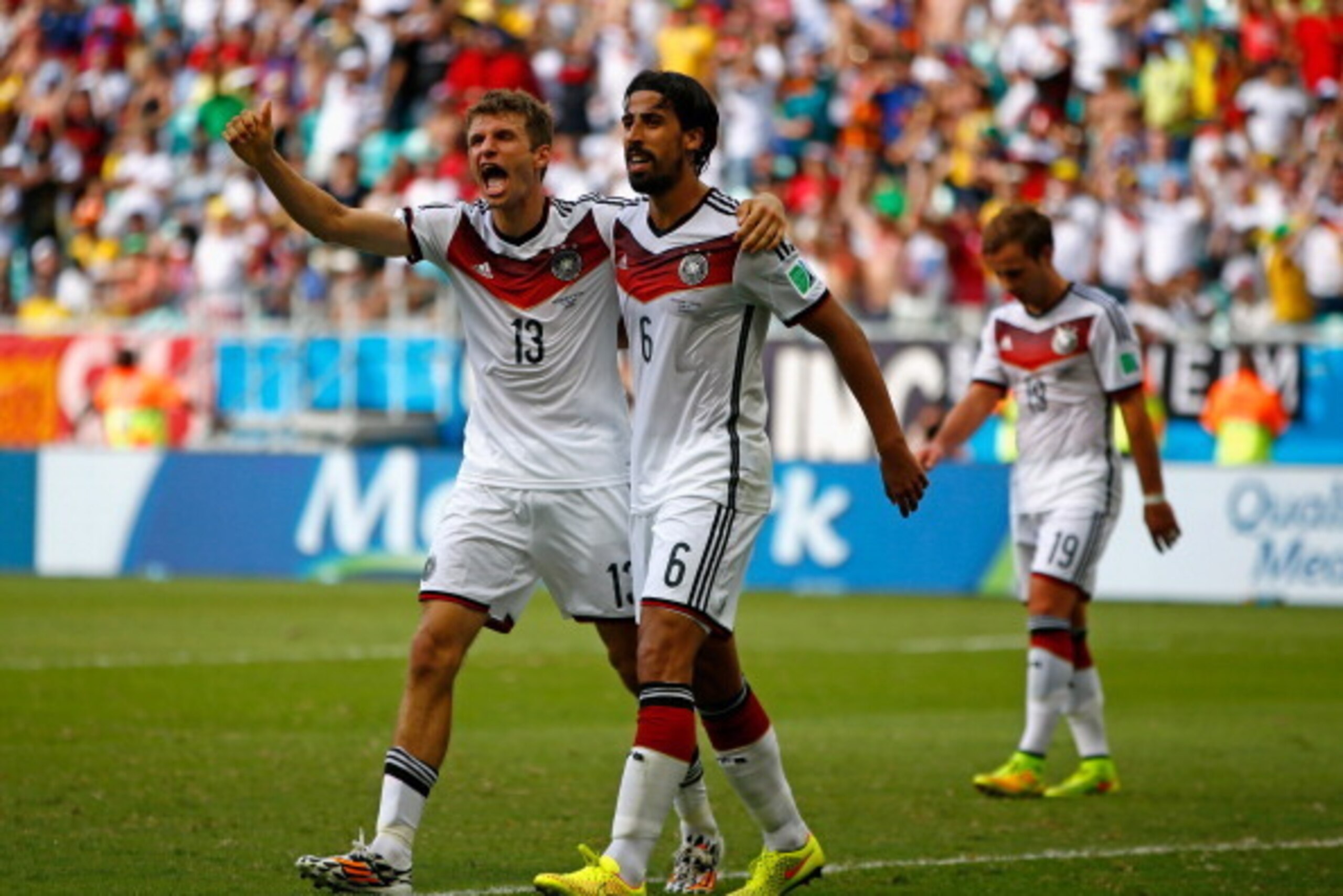 SALVADOR, BRAZIL - JUNE 16:  Thomas Mueller of Germany (L) celebrates scoring his team's fourth goal and completing his hat trick with Sami Khedira during the 2014 FIFA World Cup Brazil Group G match between Germany and Portugal at Arena Fonte Nova on Jun
