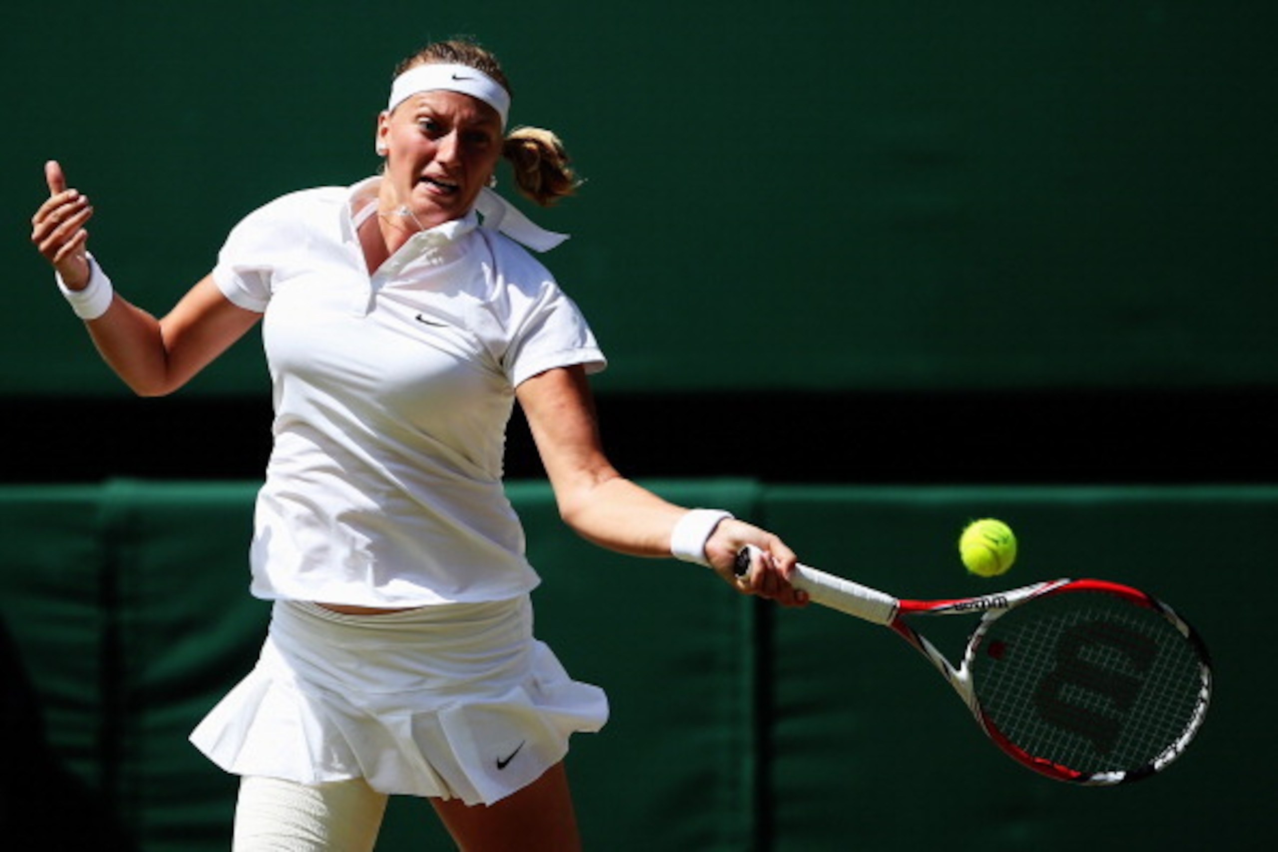 LONDON, ENGLAND - JULY 03:  Petra Kvitova of Czech Republic plays a forehand return during her Ladies' Singles semi-final match against Lucie Safarova of Czech Republic on day ten of the Wimbledon Lawn Tennis Championships at the All England Lawn Tennis a