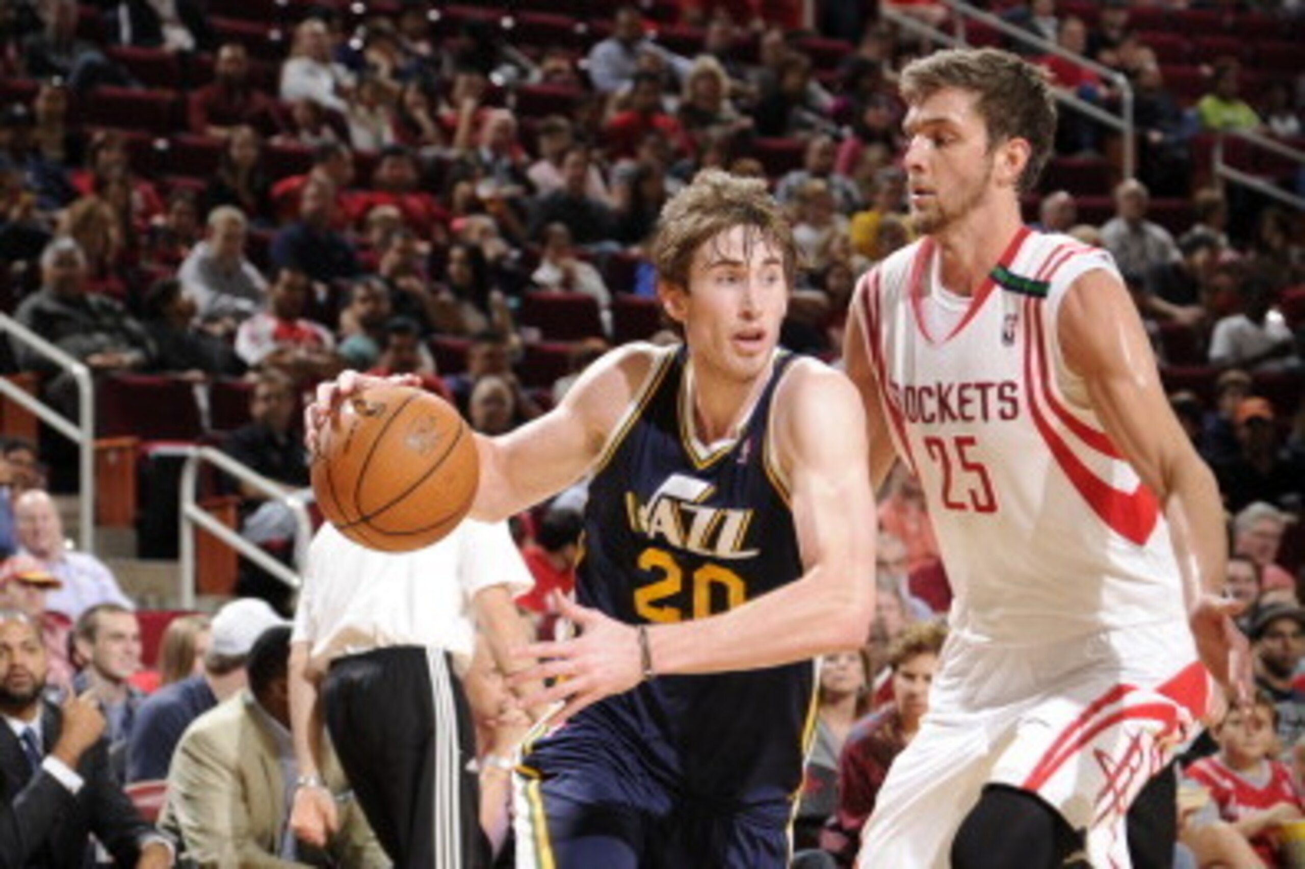 HOUSTON, TX - DECEMBER 1: Gordon Hayward #20 of the Utah Jazz drives the ball against Chandler Parsons #25 of the Houston Rockets on December 1, 2012 at the Toyota Center in Houston, Texas. NOTE TO USER: User expressly acknowledges and agrees that, by dow