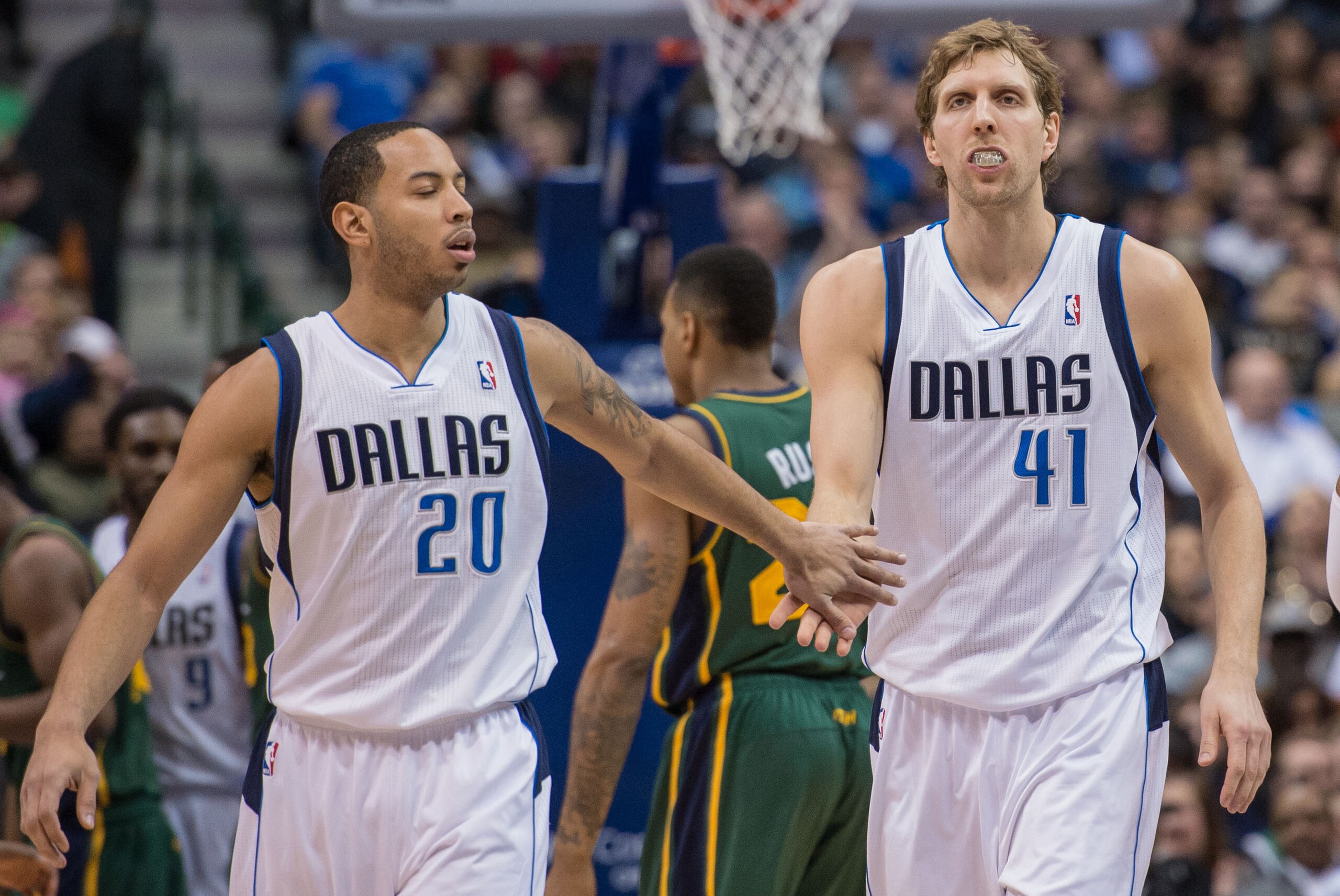 Feb 7, 2014; Dallas, TX, USA; Dallas Mavericks point guard Devin Harris (20) congratulates power forward Dirk Nowitzki (41) during the first half at American Airlines Center. The Mavericks won 103-81. Mandatory Credit: Jerome Miron-USA TODAY Sports
