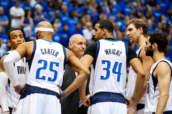 Apr 26, 2014; Dallas, TX, USA; Dallas Mavericks head coach Rick Carlisle speaks to Dallas Mavericks guard Vince Carter (25) and forward Brandan Wright (34) and guard Jose Calderon (far right) and forward Dirk Nowitzki (right) and Dallas Mavericks guard Mo