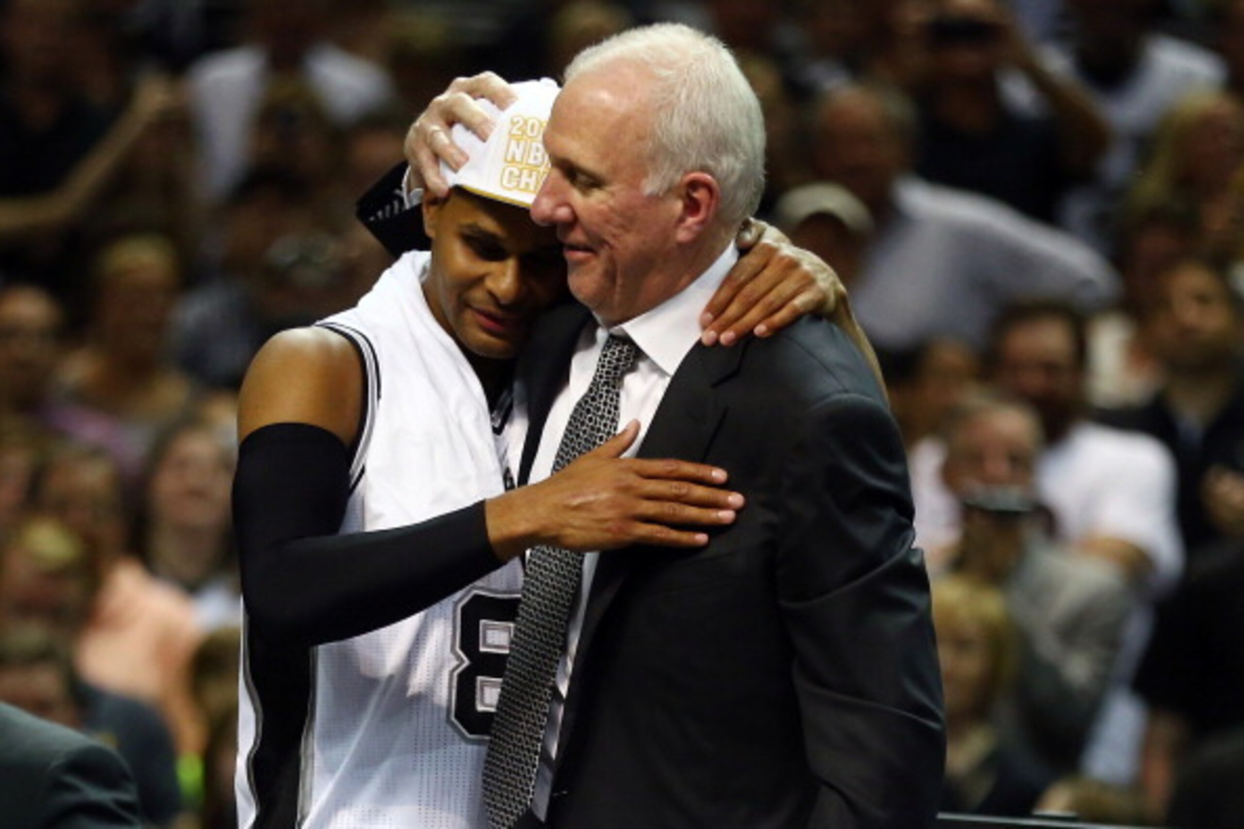 SAN ANTONIO, TX - JUNE 15: Gregg Popovich celebrates with Patty Mills #8 of the San Antonio Spurs after defeating the Miami Heat in Game Five of the 2014 NBA Finals at the AT&T Center on June 15, 2014 in San Antonio, Texas. NOTE TO USER: User expressly ac SAN ANTONIO, TX - JUNE 15: Gregg Popovich celebrates with Patty Mills #8 of the San Antonio Spurs after defeating the Miami Heat in Game Five of the 2014 NBA Finals at the AT&T Center on June 15, 2014 in San Antonio, Texas. NOTE TO USER: User expressly ac