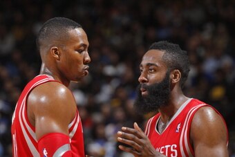 OAKLAND, CA - FEBRUARY 20: Dwight Howard #12 and James Harden #13 of the Houston Rockets during a game against the Golden State Warriors on February 20, 2014 at Oracle Arena in Oakland, California. NOTE TO USER: User expressly acknowledges and agrees that