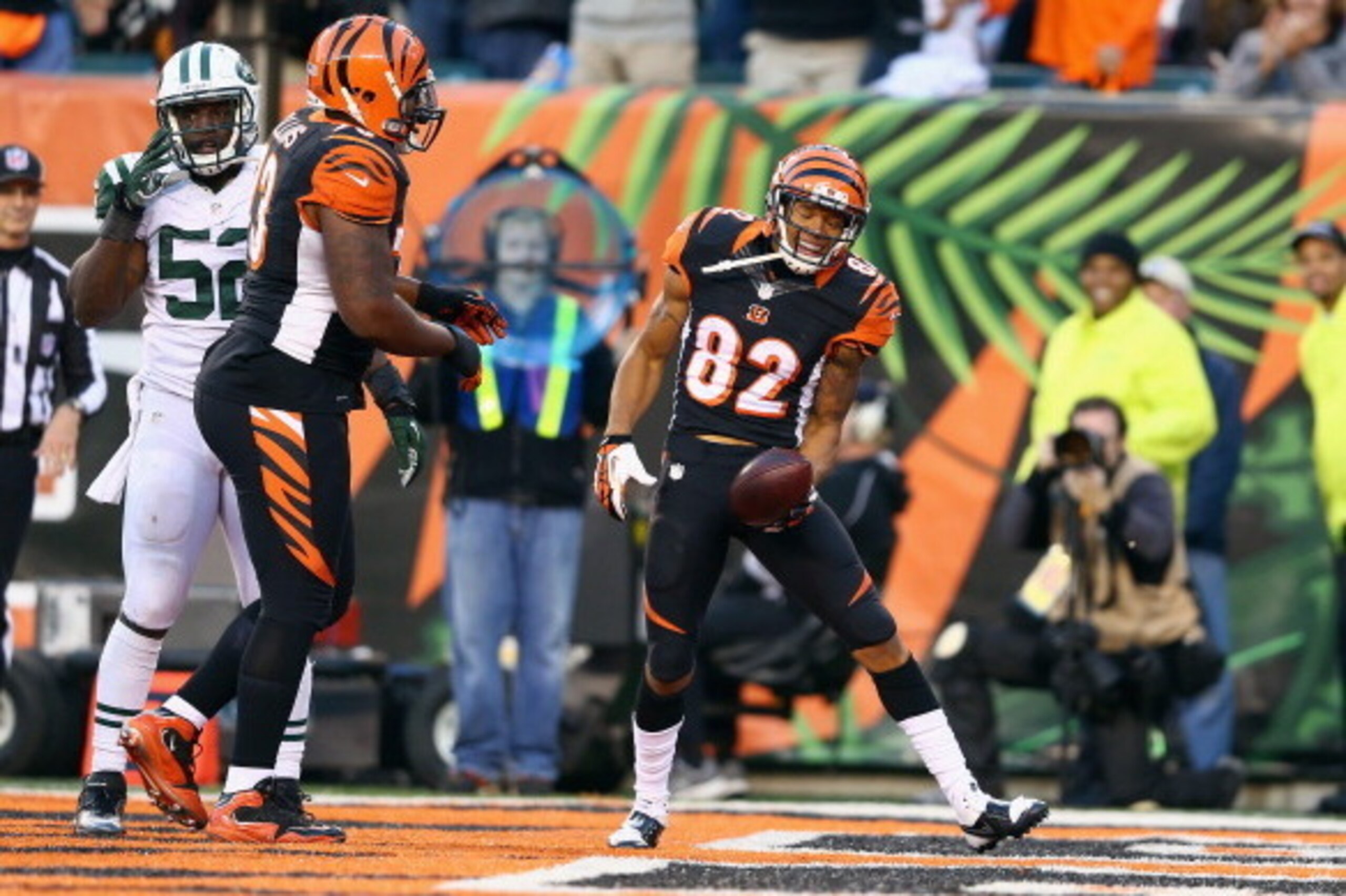 CINCINNATI, OH - OCTOBER 27:  Marvin Jones #82 of the Cincinnati Bengals celebrates with Anthony Collins #73 (left) after scoring a touchdown during the NFL game against the New York Jets at Paul Brown Stadium on October 27, 2013 in Cincinnati, Ohio.  (Ph