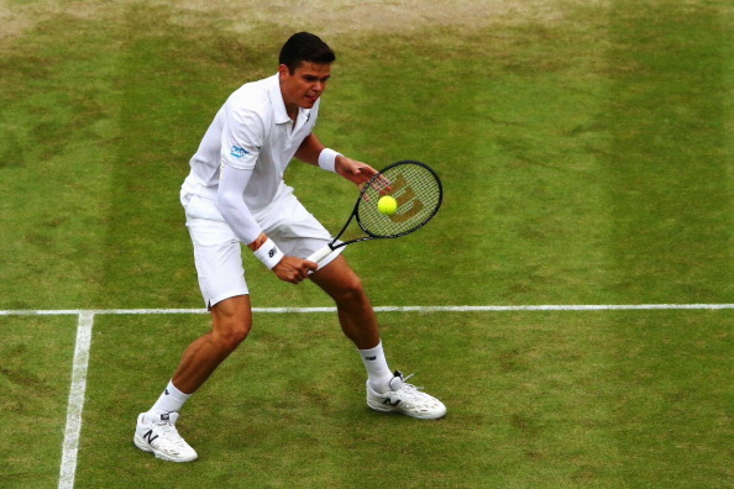LONDON, ENGLAND - JULY 02:  Milos Raonic of Canada during his Gentlemen's Singles quarter-final match against Nick Kyrgios of Australia on day nine of the Wimbledon Lawn Tennis Championships at the All England Lawn Tennis and Croquet Club  at Wimbledon on
