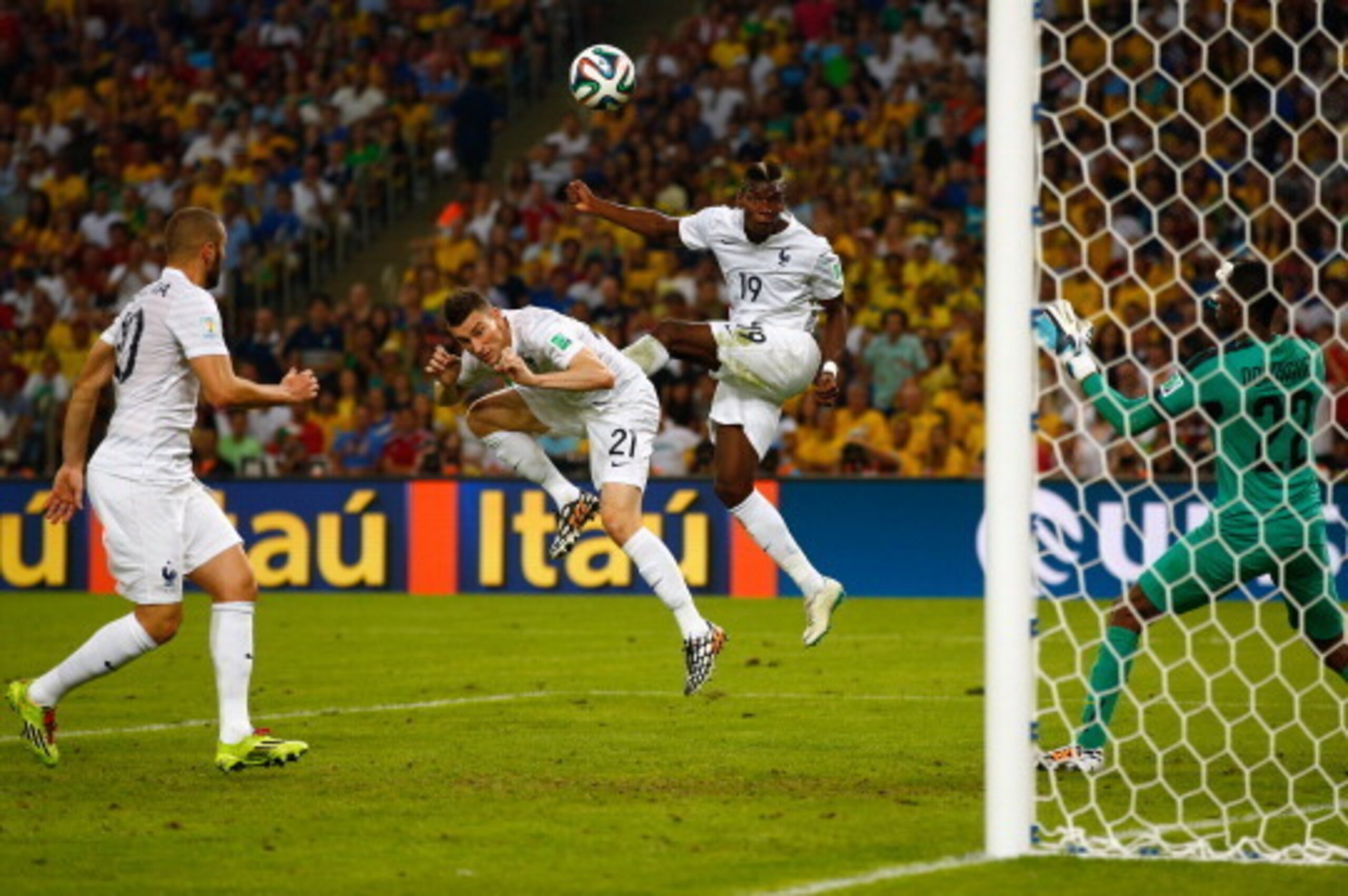 RIO DE JANEIRO, BRAZIL - JUNE 25: Paul Pogba of France heads the ball wide of the goal past Alexander Dominguez of Ecuador during the 2014 FIFA World Cup Brazil Group E match between Ecuador and France at Maracana on June 25, 2014 in Rio de Janeiro, Brazi