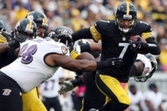Oct 20, 2013; Pittsburgh, PA, USA; Pittsburgh Steelers quarterback Ben Roethlisberger (7) is sacked by Baltimore Ravens defensive tackle Brandon Williams (98) during the first half at Heinz Field. Mandatory Credit: Jason Bridge-USA TODAY Sports