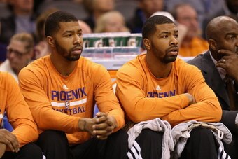 PHOENIX, AZ - JANUARY 22:  (L-R) Markieff Morris #11 and Marcus Morris #15 of the Phoenix Suns on the bench during the NBA game against the Indiana Pacers at US Airways Center on January 22, 2014 in Phoenix, Arizona. The Suns defeated the Pacers 124-100. 