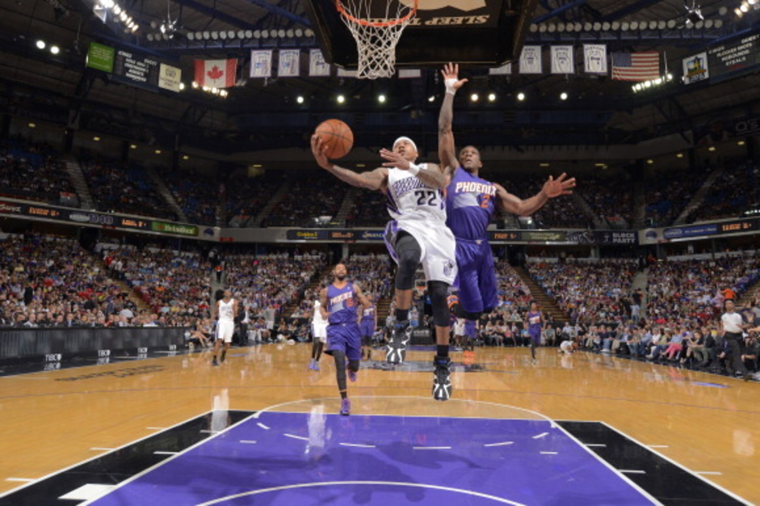 SACRAMENTO, CA - APRIL 16: Isaiah Thomas #22 of the Sacramento Kings shoots a layup against Eric Bledsoe #2 of the Phoenix Suns on April16, 2014 at Sleep Train Arena in Sacramento, California. NOTE TO USER: User expressly acknowledges and agrees that, by 