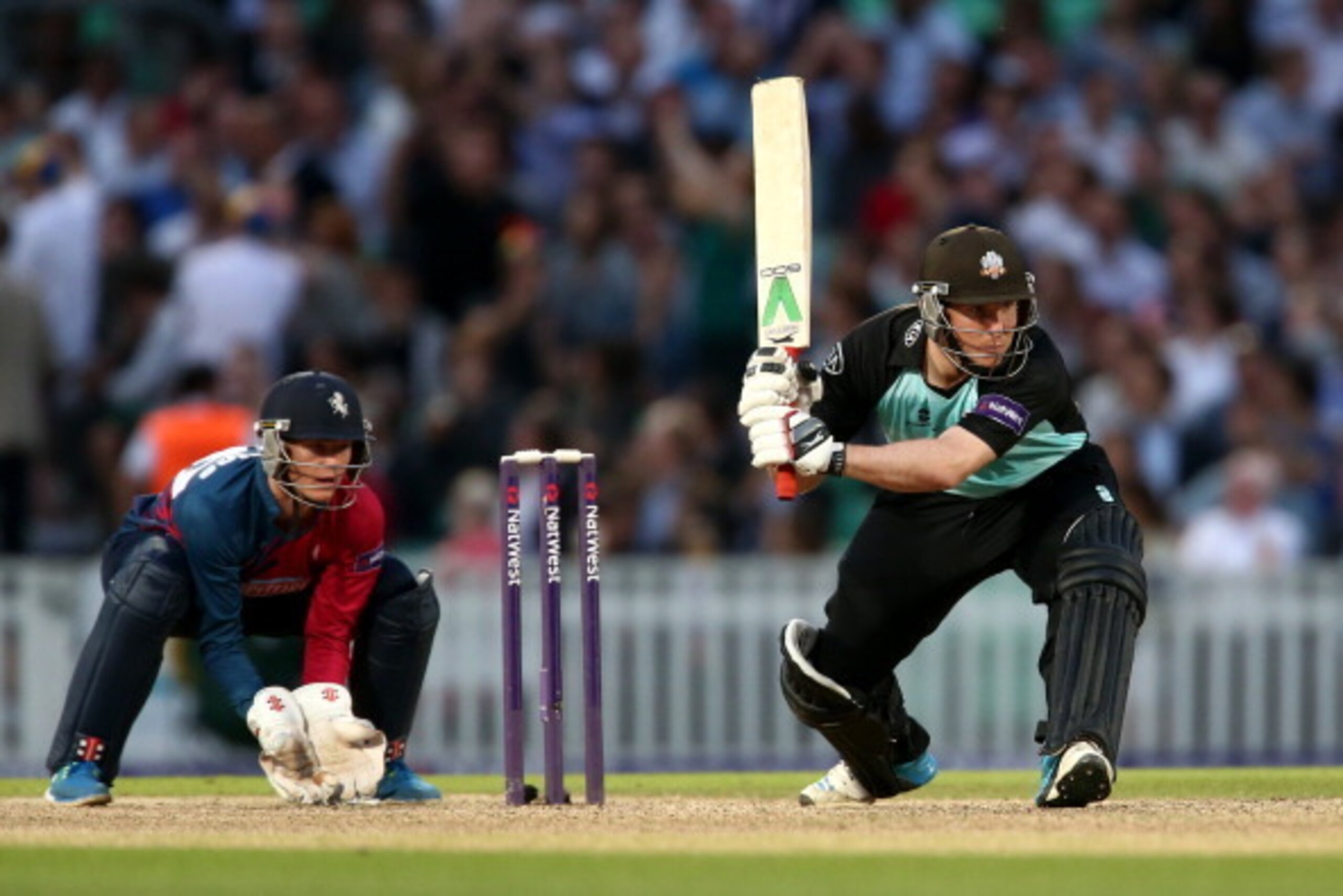 LONDON, ENGLAND - JULY 02: Gary Wilson of Surrey hits out during the Natwest T20 Blast match between Surrey and Kent Spitfires at The Kia Oval on July 2, 2014 in London, England. (Photo by Jordan Mansfield/Getty Images) LONDON, ENGLAND - JULY 02: Gary Wilson of Surrey hits out during the Natwest T20 Blast match between Surrey and Kent Spitfires at The Kia Oval on July 2, 2014 in London, England. (Photo by Jordan Mansfield/Getty Images)