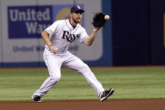 ST. PETERSBURG, FL - JUNE 23:  Second baseman Ben Zobrist #18 of the Tampa Bay Rays fields a grounder off the bat of Gregory Polanco (not pictured) of the Pittsburgh Pirates during the first inning of a game on June 23, 2014 at Tropicana Field in St. Pete