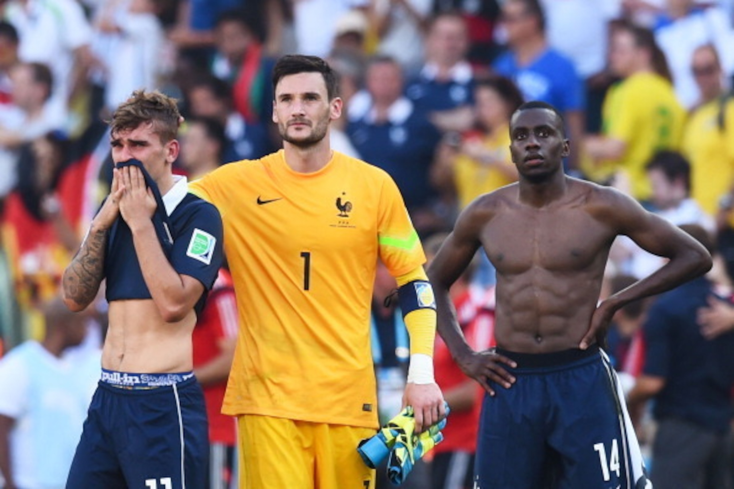 RIO DE JANEIRO, BRAZIL - JULY 04: (L-R) Antoine Griezmann, Hugo Lloris and Blaise Matuidi of France react after being defeated by Germany 1-0 during the 2014 FIFA World Cup Brazil Quarter Final match between France and Germany at Maracana on July 4, 2014 