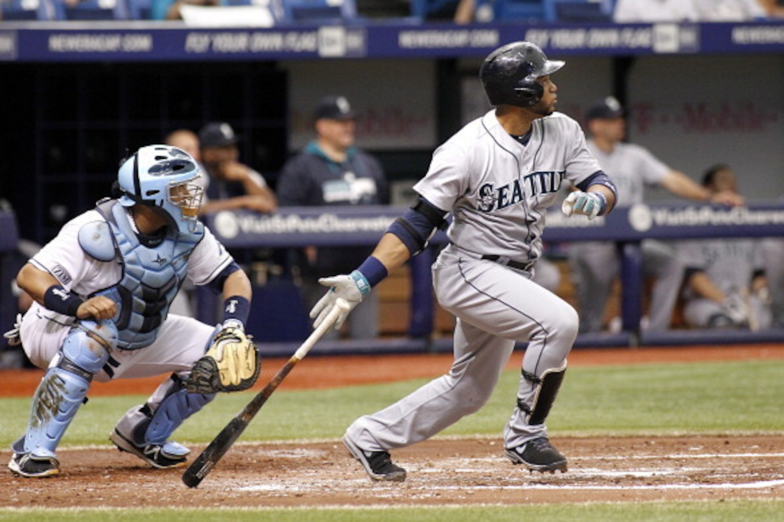 ST. PETERSBURG, FL - JUNE 9:  Catcher Jose Molina #28 of the Tampa Bay Rays looks on as Robinson Cano #22 of the Seattle Mariners hits a two-run single during the third inning of a game on June 9, 2014 at Tropicana Field in St. Petersburg, Florida.  (Phot