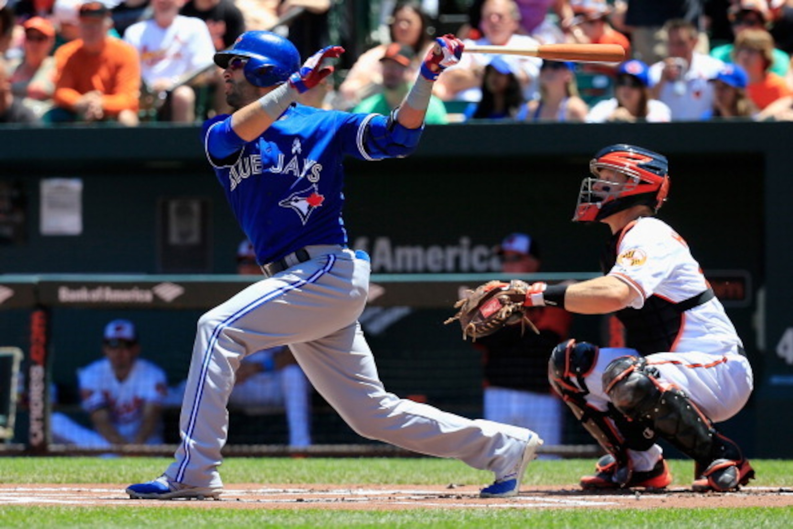 BALTIMORE, MD - JUNE 15: Catcher Nick Hundley #40 of the Baltimore Orioles looks on as Jose Bautista #19 of the Toronto Blue Jays follows his RBI double during the first inning at Oriole Park at Camden Yards on June 15, 2014 in Baltimore, Maryland.  (Phot