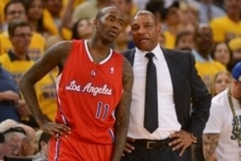 May 1, 2014; Oakland, CA, USA; Los Angeles Clippers guard Jamal Crawford (11) talks to head coach Doc Rivers (right) during the third quarter in game six of the first round of the 2014 NBA Playoffs against the Golden State Warriors at Oracle Arena. The Wa