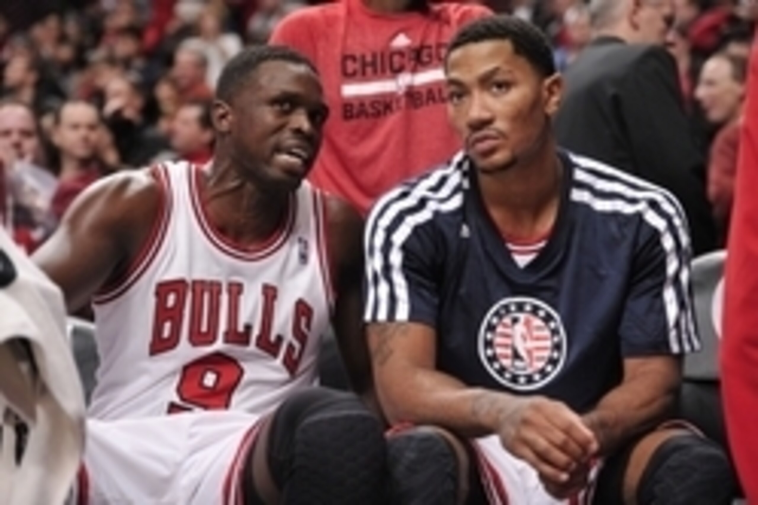 Nov 11, 2013; Chicago, IL, USA; Chicago Bulls small forward Luol Deng (9) talks with point guard Derrick Rose (1) on the bench during the second half against the Cleveland Cavaliers at the United Center. The Bulls won 96-81. Mandatory Credit: Rob Grabowsk