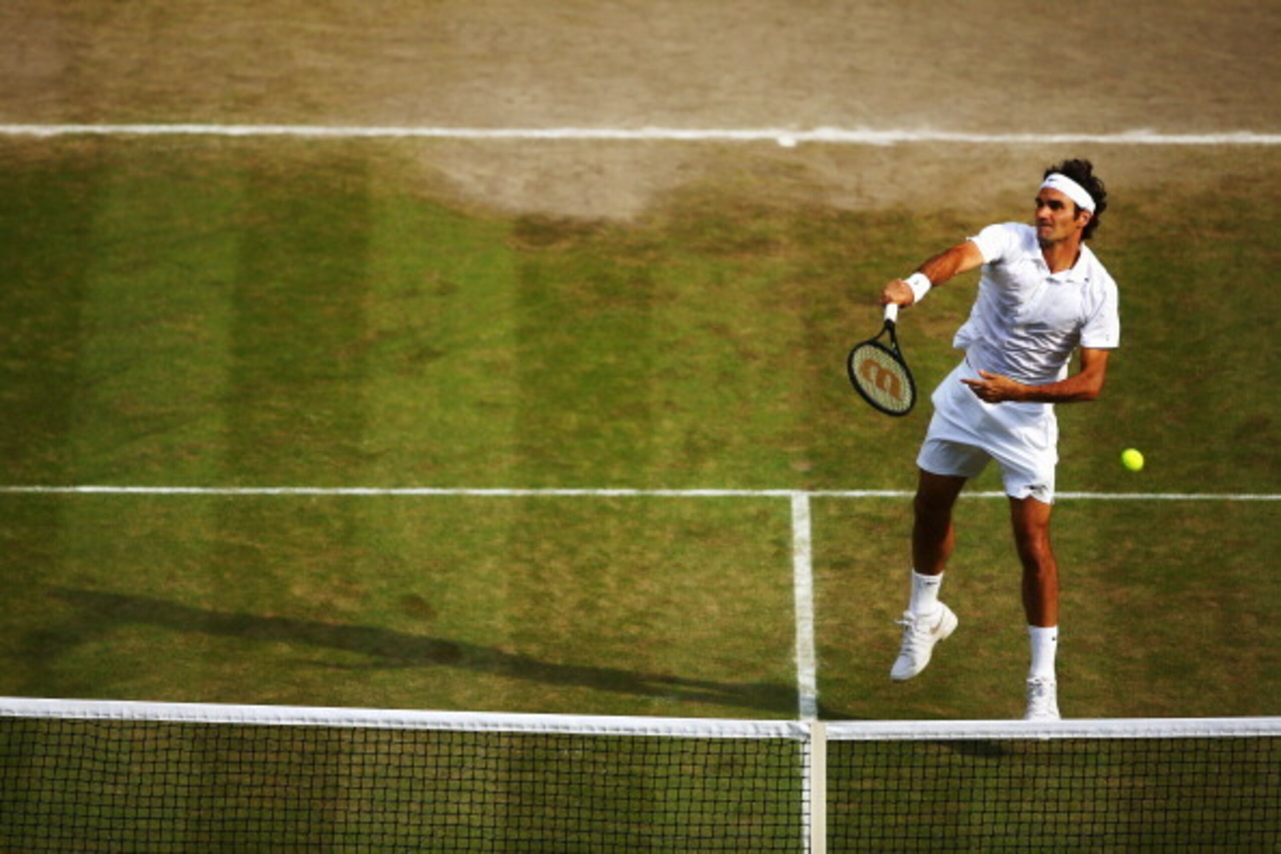 LONDON, ENGLAND - JULY 04:  Roger Federer of Switzerland during his Gentlemen's Singles semi-final match against Milos Raonic of Canada on day eleven of the Wimbledon Lawn Tennis Championships at the All England Lawn Tennis and Croquet Club on July 4, 201