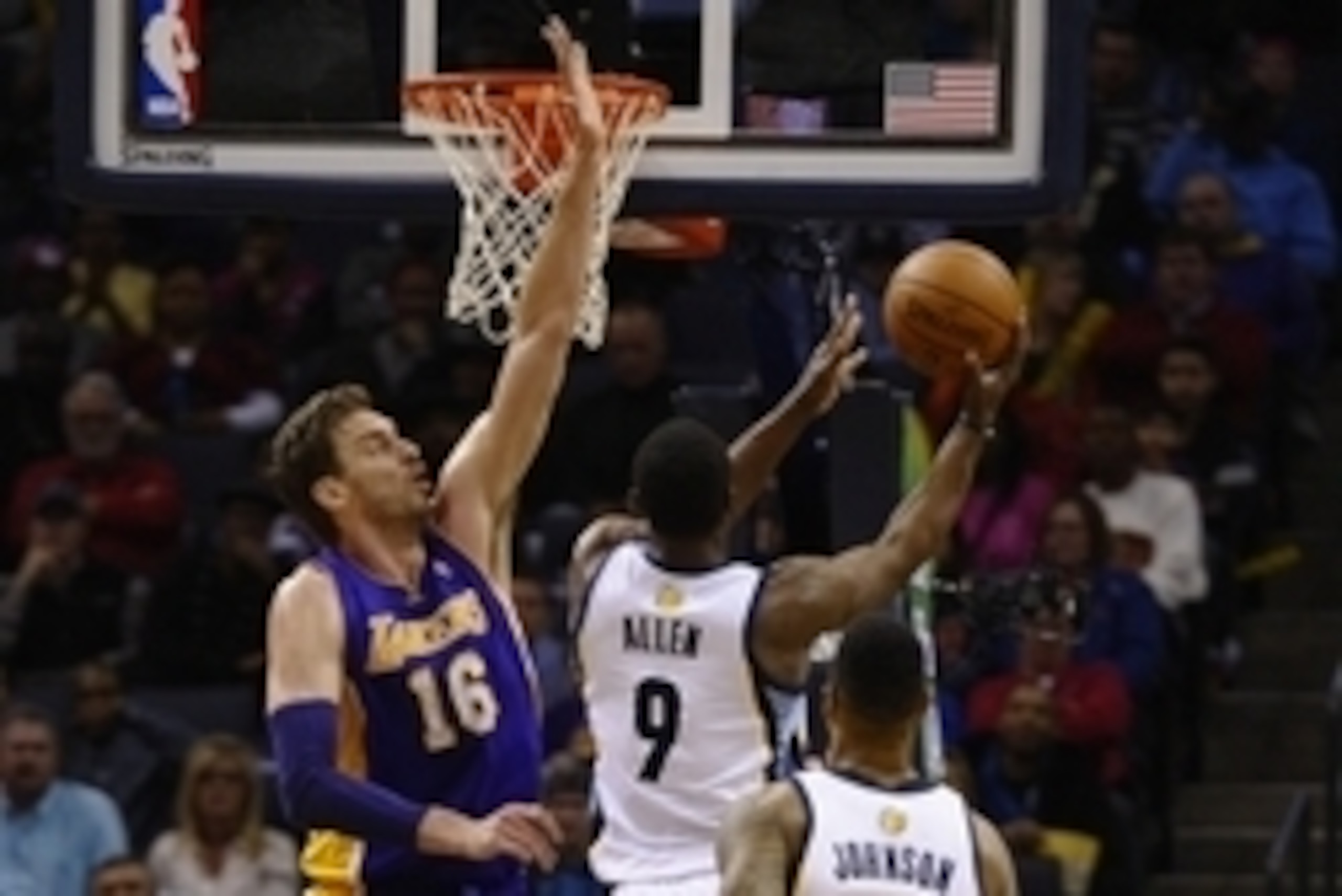 Feb 26, 2014; Memphis, TN, USA; Memphis Grizzlies shooting guard Tony Allen (9) lays the ball up against Los Angeles Lakers center Pau Gasol (16) during the game at FedExForum. Memphis Grizzlies beat Los Angeles Lakers 108 - 103. Mandatory Credit: Justin 