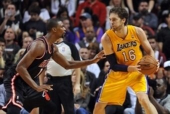 Jan 23, 2014; Miami, FL, USA; Los Angeles Lakers center Pau Gasol (16) is pressured by Miami Heat center Chris Bosh (1) during the second half at American Airlines Arena. Mandatory Credit: Steve Mitchell-USA TODAY Sports