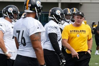 Mike Munchak will implement the outside zone-blocking scheme.