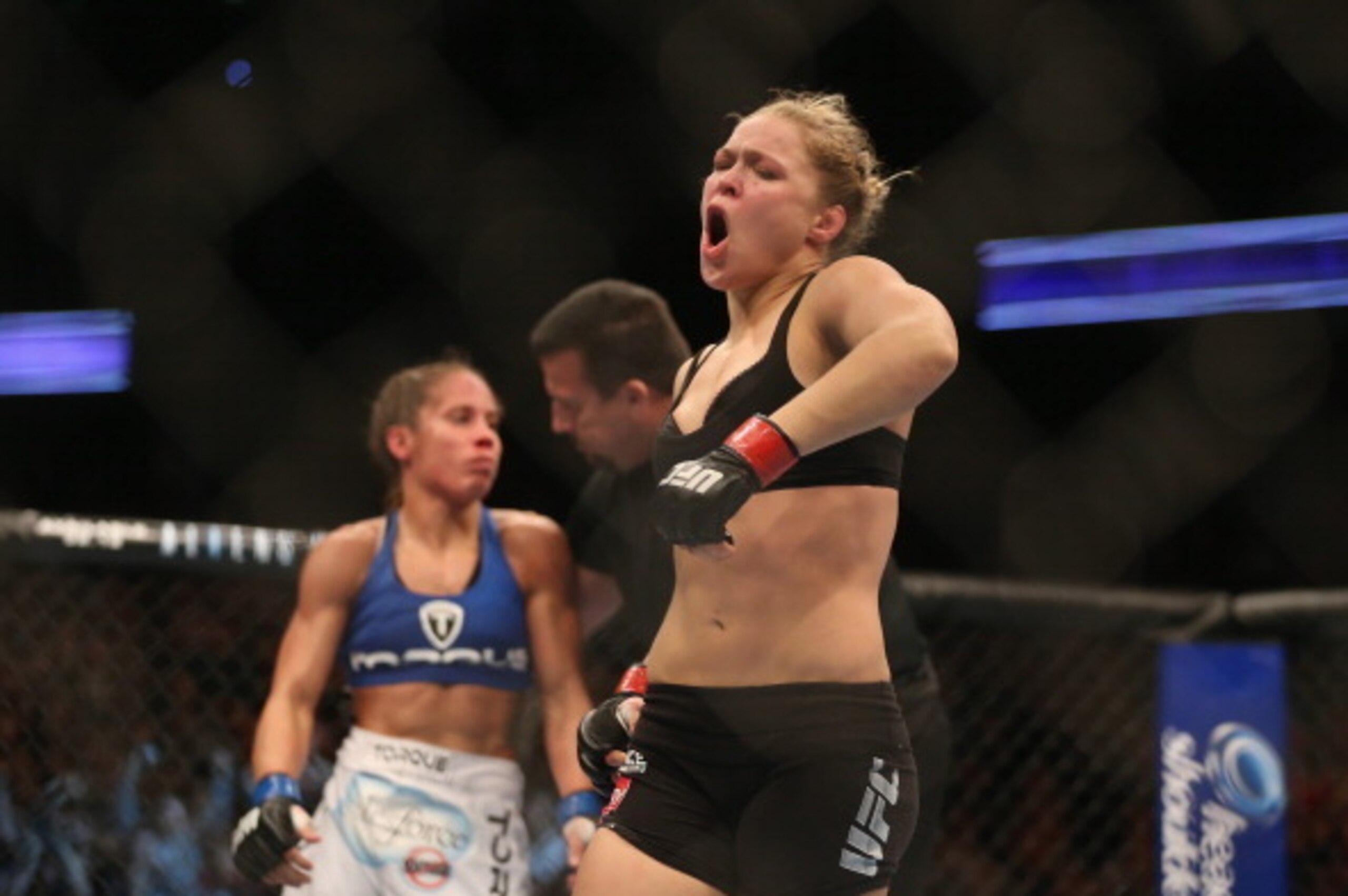 ANAHEIM, CA - FEBRUARY 23:  Ronda Rousey celebrates her UFC Bantamweight Title over Liz Carmouche at Honda Center on February 23, 2013 in Anaheim, California.  (Photo by Jeff Gross/Getty Images)