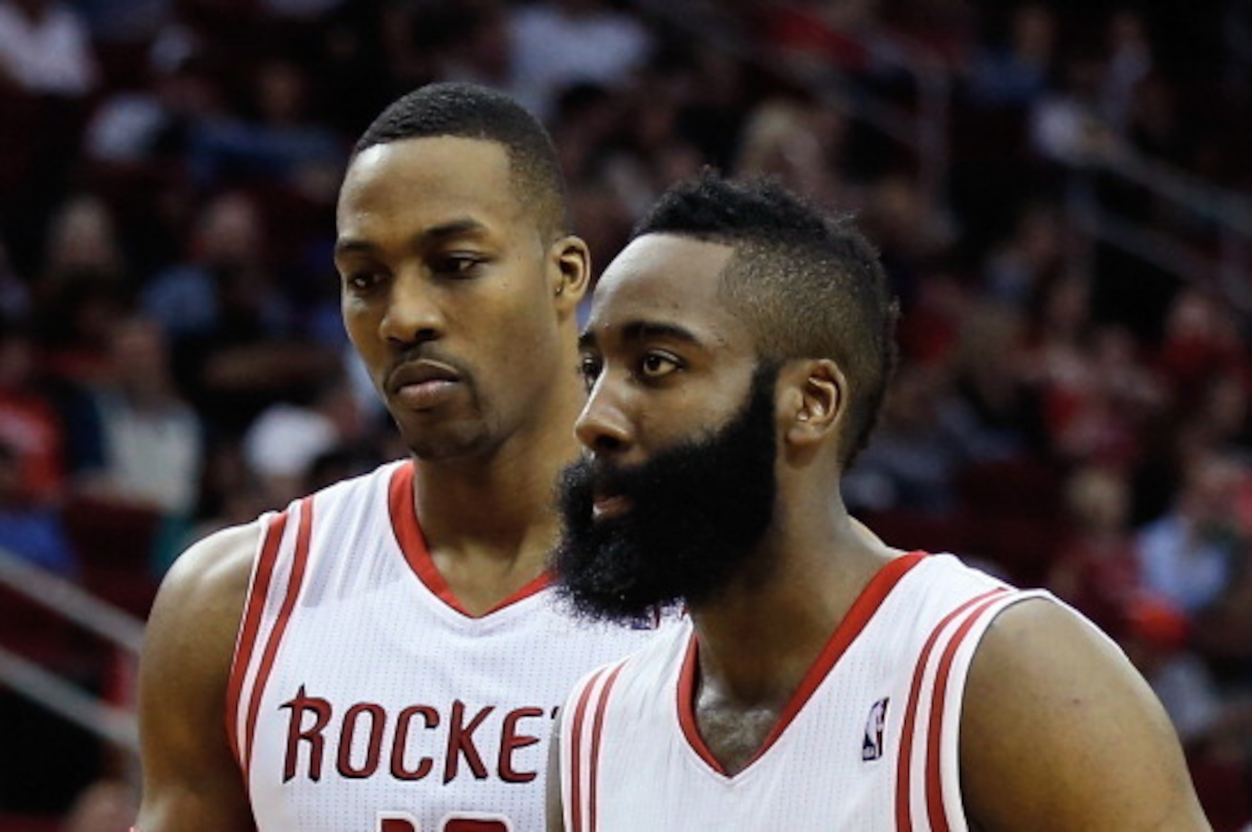HOUSTON, TX - MARCH 01:  Dwight Howard #12 and James Harden #13 of the Houston Rockets walk across the court during the game against the Detroit Pistons at the Toyota Center on March 1, 2014 in Houston, Texas. NOTE TO USER: User expressly acknowledges and