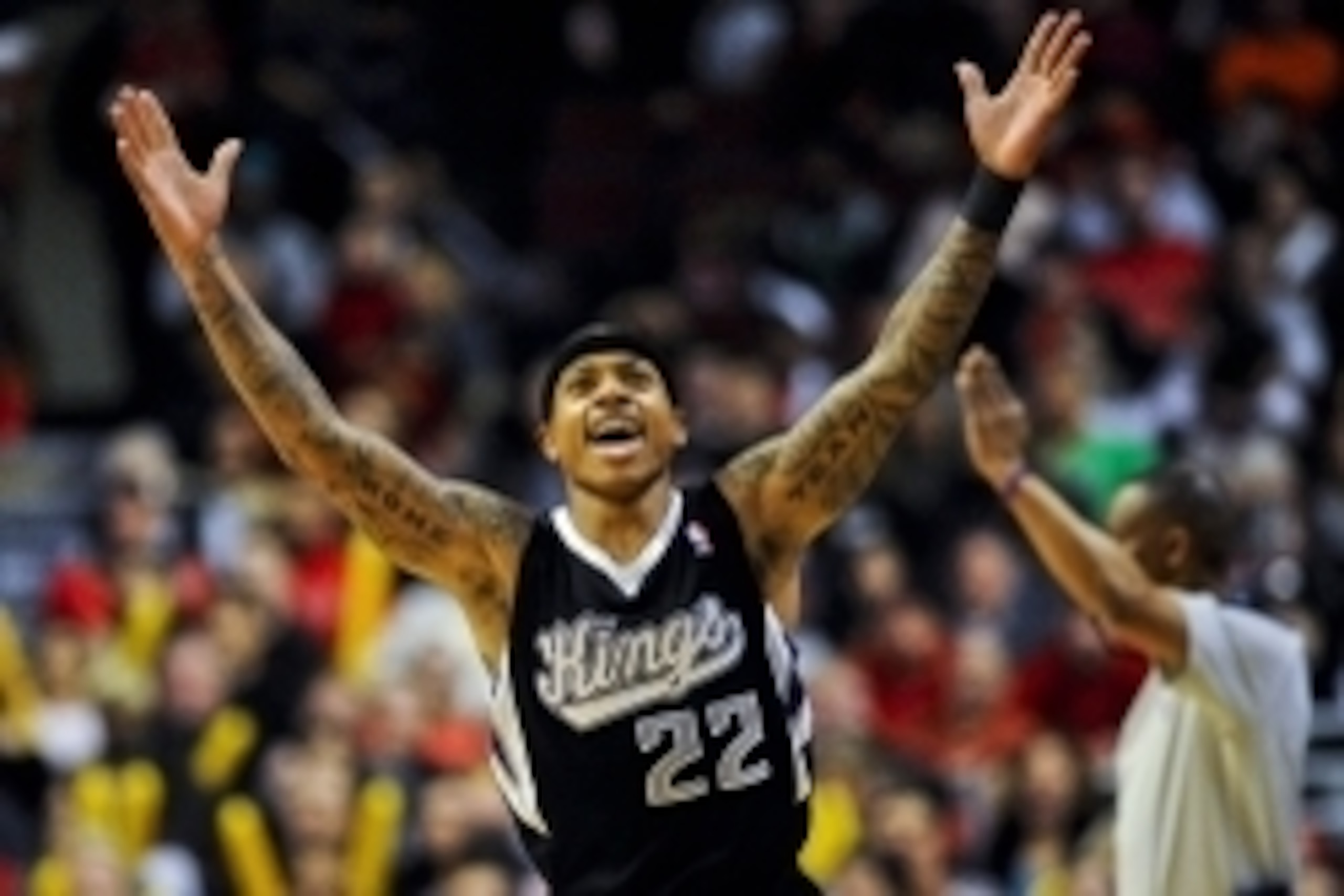 Mar 15, 2014; Chicago, IL, USA; Sacramento Kings guard Isaiah Thomas (22) reacts after scoring against the Chicago Bulls at the United Center. The Bulls won 94-87.  Mandatory Credit: Matt Marton-USA TODAY Sports