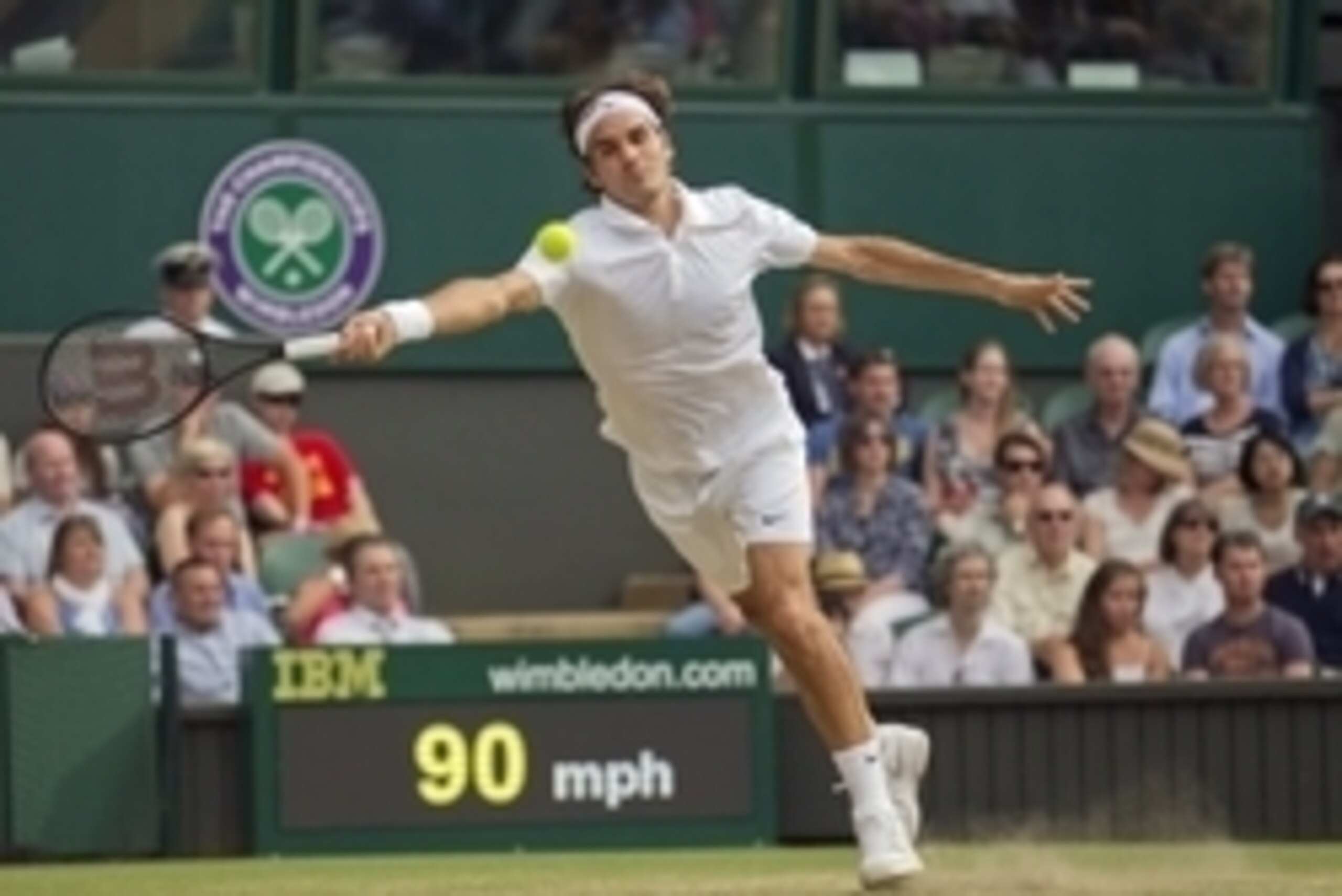 Jul 2, 2014; London, United Kingdom; Roger Federer (SUI) in action during his match against Stan Wawrinka (SUI) on day nine of the 2014 Wimbledon Championships at the All England Lawn and Tennis Club. Mandatory Credit: Susan Mullane-USA TODAY Sports