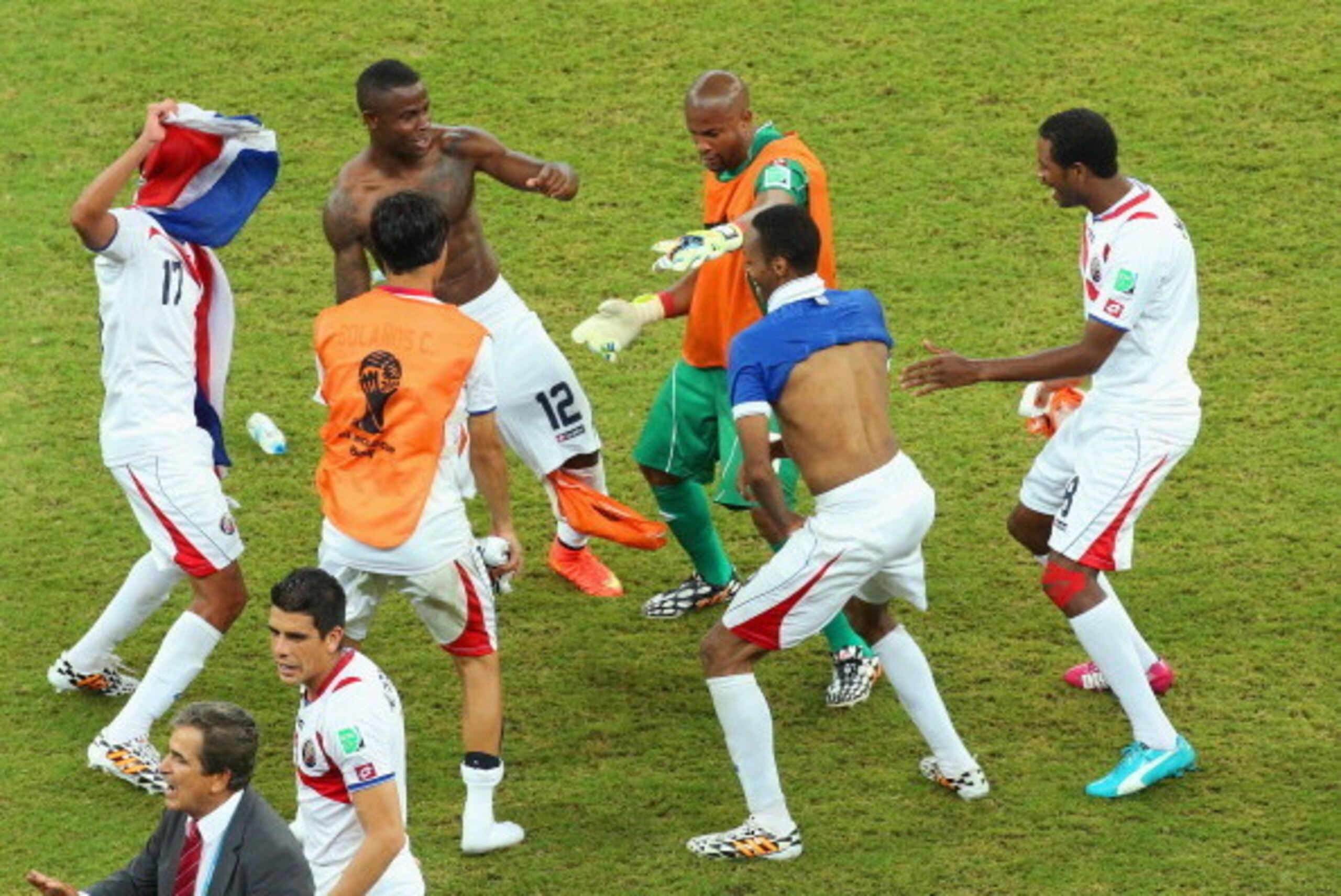 RECIFE, BRAZIL - JUNE 29:  Costa Rica players dance and celebrate after defeating Greece in a penalty shootout during the 2014 FIFA World Cup Brazil Round of 16 match between Costa Rica and Greece at Arena Pernambuco on June 29, 2014 in Recife, Brazil.  (
