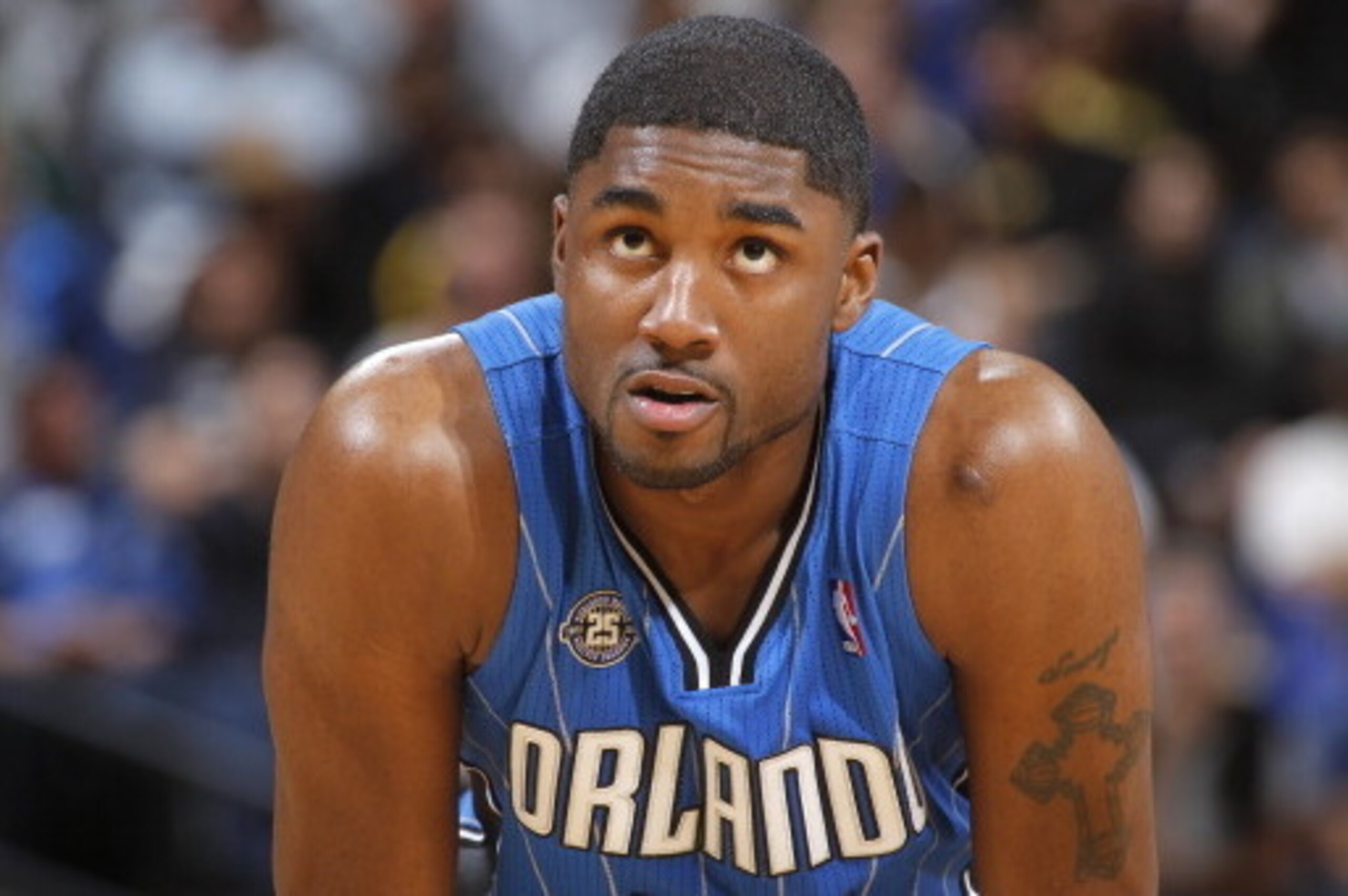 OAKLAND, CA - MARCH 18: E'Twaun Moore #55 of the Orlando Magic while facing the Golden State Warriors on March 18, 2014 at Oracle Arena in Oakland, California. NOTE TO USER: User expressly acknowledges and agrees that, by downloading and or using this pho