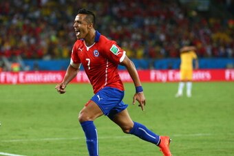 CUIABA, BRAZIL - JUNE 13:  Alexis Sanchez of Chile celebrates after scoring his team's first goal during the 2014 FIFA World Cup Brazil Group B match between Chile and Australia at Arena Pantanal on June 13, 2014 in Cuiaba, Brazil.  (Photo by Cameron Spen