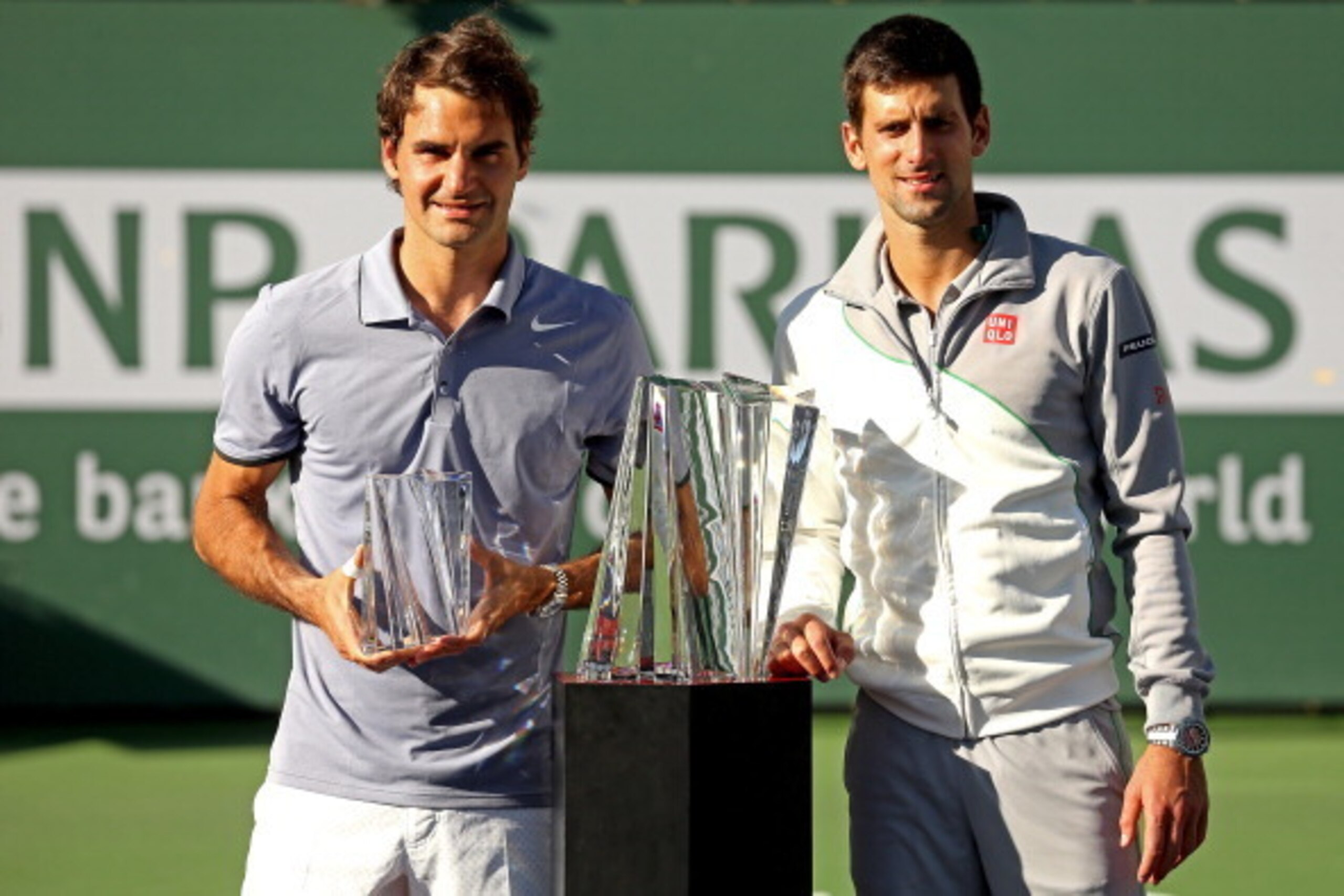 INDIAN WELLS, CA - MARCH 16: Roger Federer of Switzerland and Novak Djokovic of Serbia pose for photographers after their match during the final of the BNP Parabas Open at the Indian Wells Tennis Garden on March 16, 2014 in Indian Wells, California.  (Pho