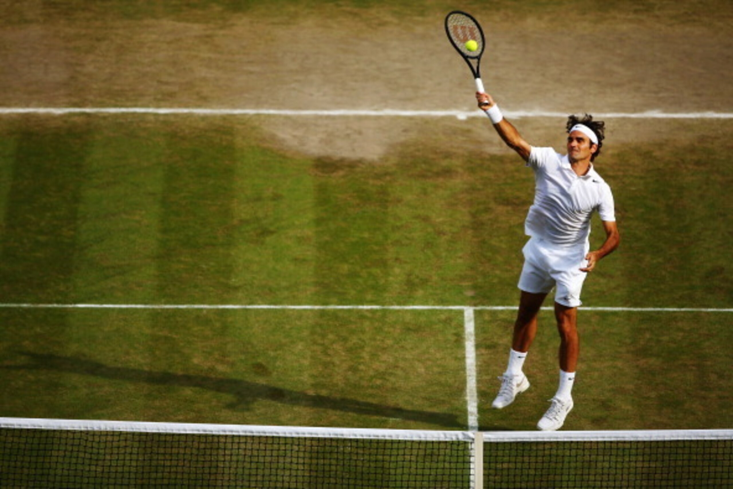 LONDON, ENGLAND - JULY 04:  Roger Federer of Switzerland during his Gentlemen's Singles semi-final match against Milos Raonic of Canada on day eleven of the Wimbledon Lawn Tennis Championships at the All England Lawn Tennis and Croquet Club on July 4, 201