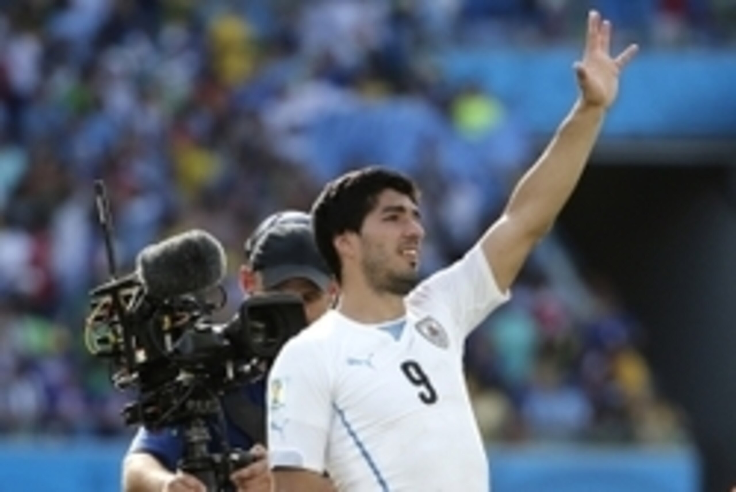 Jun 24, 2014; Natal, Rio Grande do Norte, BRAZIL; Uruguay forward Luis Suarez (9) salutes the fans after their 1-0 win over Italy in a 2014 World Cup game at Estadio das Dunas. Mandatory Credit: Winslow Townson-USA TODAY Sports