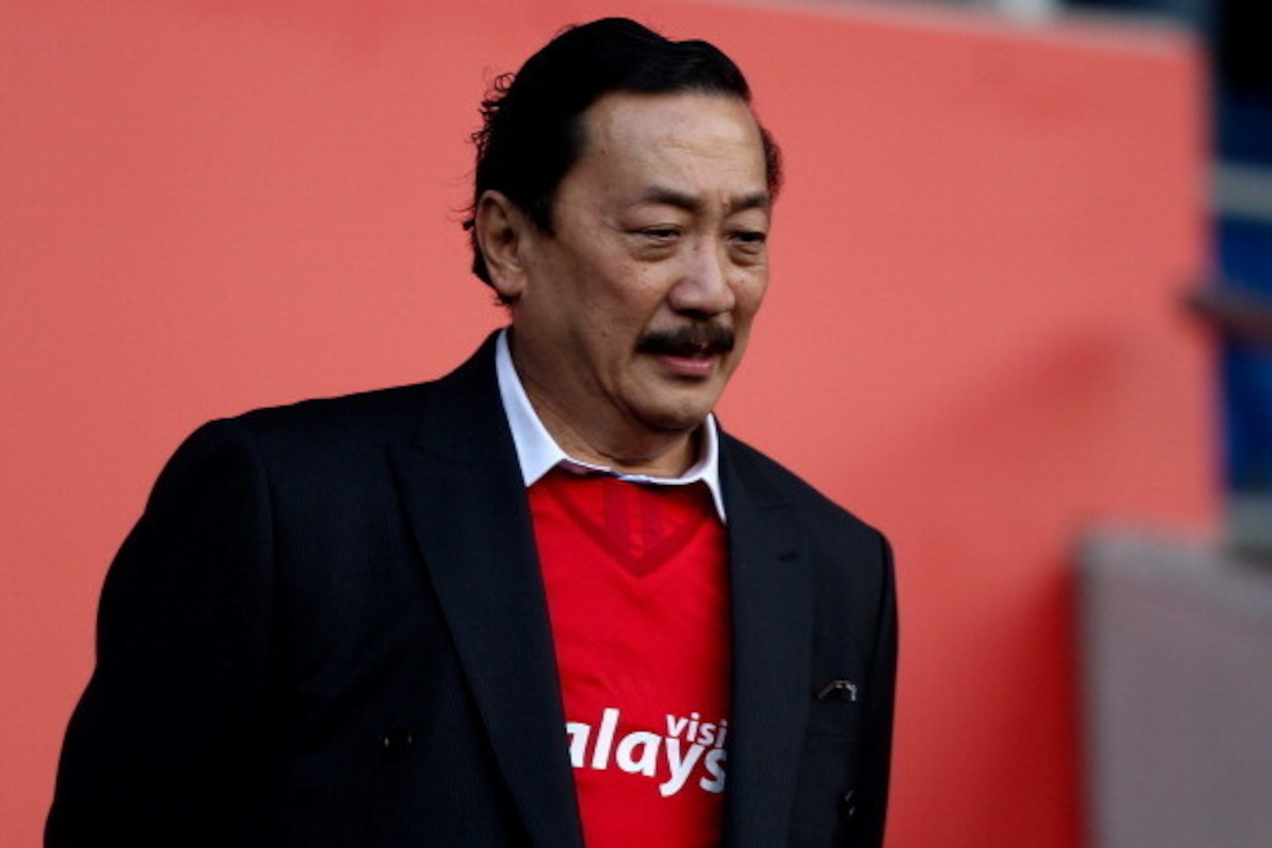 CARDIFF, WALES - FEBRUARY 01: Cardiff owner Vincent Tan looks on prior to the Barclays Premier League match between Cardiff City and Norwich City at Cardiff City Stadium on February 1, 2014 in Cardiff, Wales.  (Photo by Ben Hoskins/Getty Images)