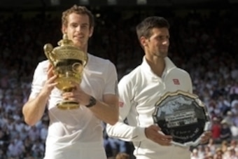 Jul 7, 2013; London, United Kingdom; Andy Murray (GBR) celebrates with the trophy after his match against Novak Djokovic (SRB) on day 13 of the 2013 Wimbledon Championships at the All England Lawn Tennis Club. Mandatory Credit: Susan Mullane-USA TODAY Spo