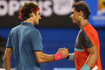 MELBOURNE, AUSTRALIA - JANUARY 24: Rafael Nadal of Spain shakes hands with Roger Federer of Switzerland after Nadal won their semifinal match during day 12 of the 2014 Australian Open at Melbourne Park on January 24, 2014 in Melbourne, Australia.  (Photo 