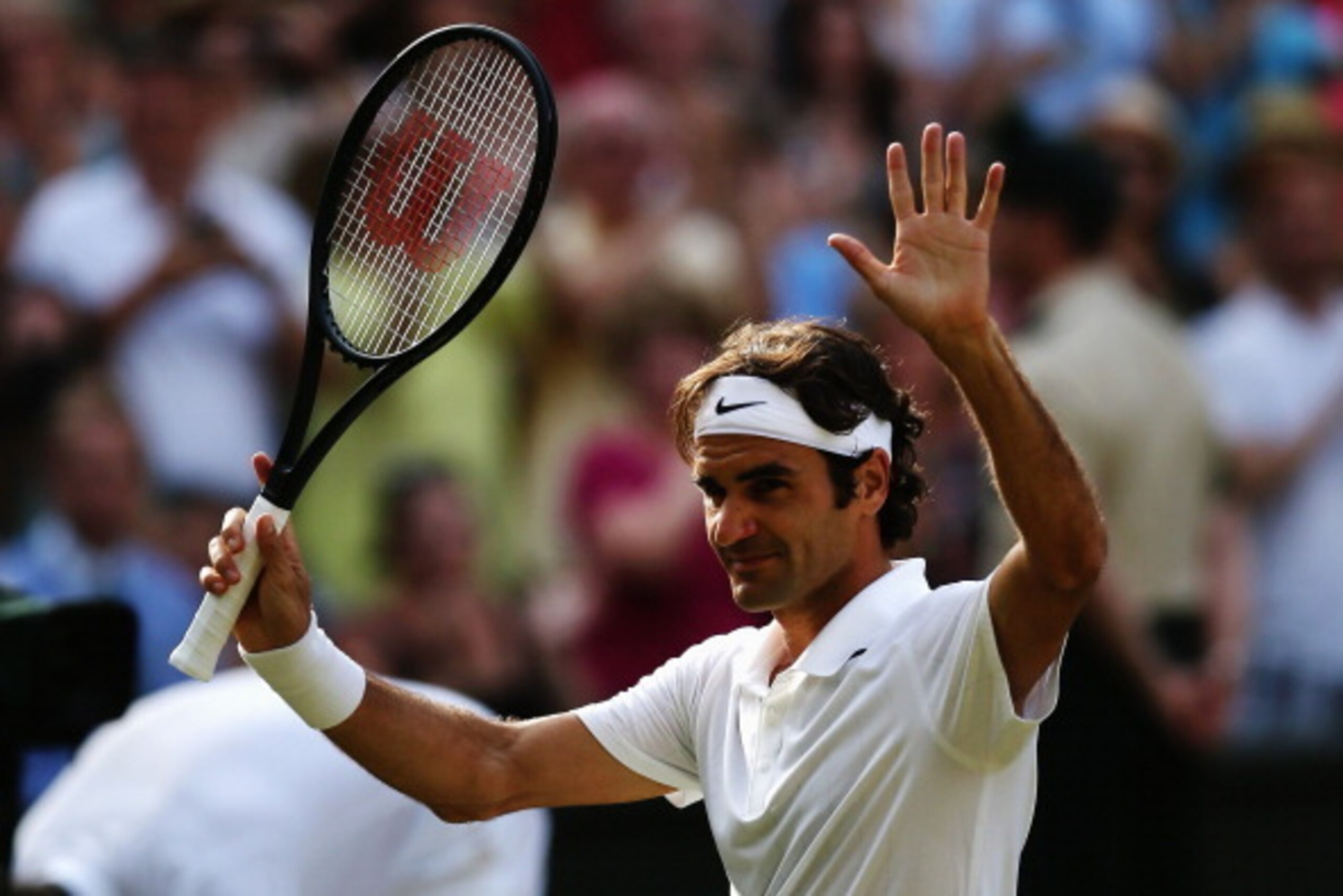 LONDON, ENGLAND - JULY 04:  Roger Federer of Switzerland celebrates after winning his Gentlemen's Singles semi-final match against Milos Raonic of Canada on day eleven of the Wimbledon Lawn Tennis Championships at the All England Lawn Tennis and Croquet C