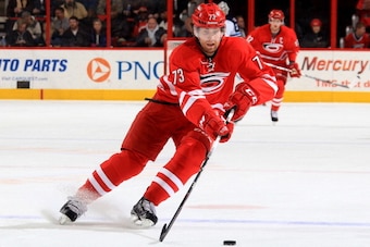 RALEIGH, NC - FEBRUARY 04:  Brett Bellemore #73 of the Carolina Hurricanes collects a loose puck during an NHL game against the Winnipeg Jets at PNC Arena on February 4, 2014 in Raleigh, North Carolina.  (Photo by Gregg Forwerck/NHLI via Getty Images)
