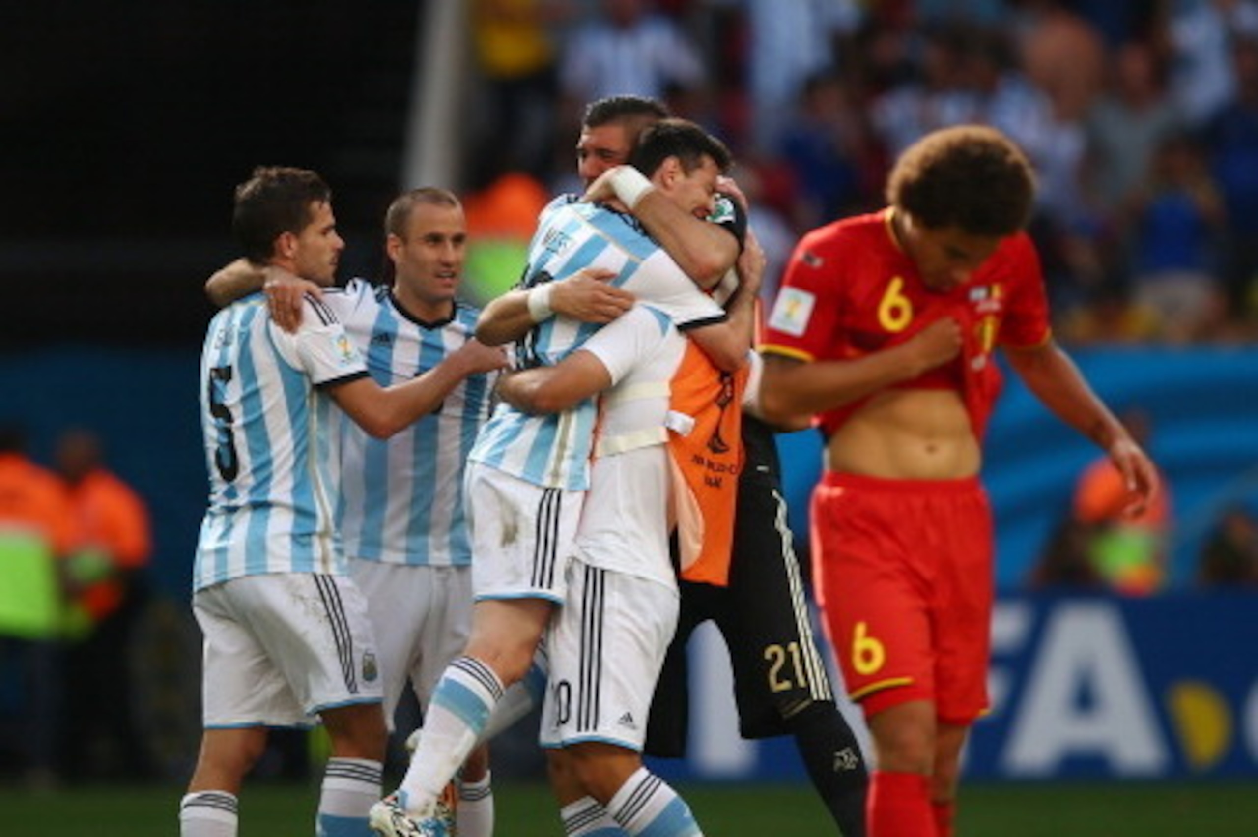 BRASILIA, BRAZIL - JULY 05: (L-R) Fernando Gago, Rodrigo Palacio, Lionel Messi, Sergio Aguero and Mariano Andujar of Argentina celebrate after defeating Belgium 1-0 as Axel Witsel of Belgium reacts during the 2014 FIFA World Cup Brazil Quarter Final match