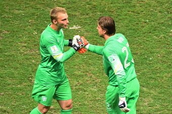 SALVADOR, BRAZIL - JULY 05: Tim Krul of the Netherlands shakes hands with Jasper Cillessen as he enters the game during the 2014 FIFA World Cup Brazil Quarter Final match between the Netherlands and Costa Rica at Arena Fonte Nova on July 5, 2014 in Salvad