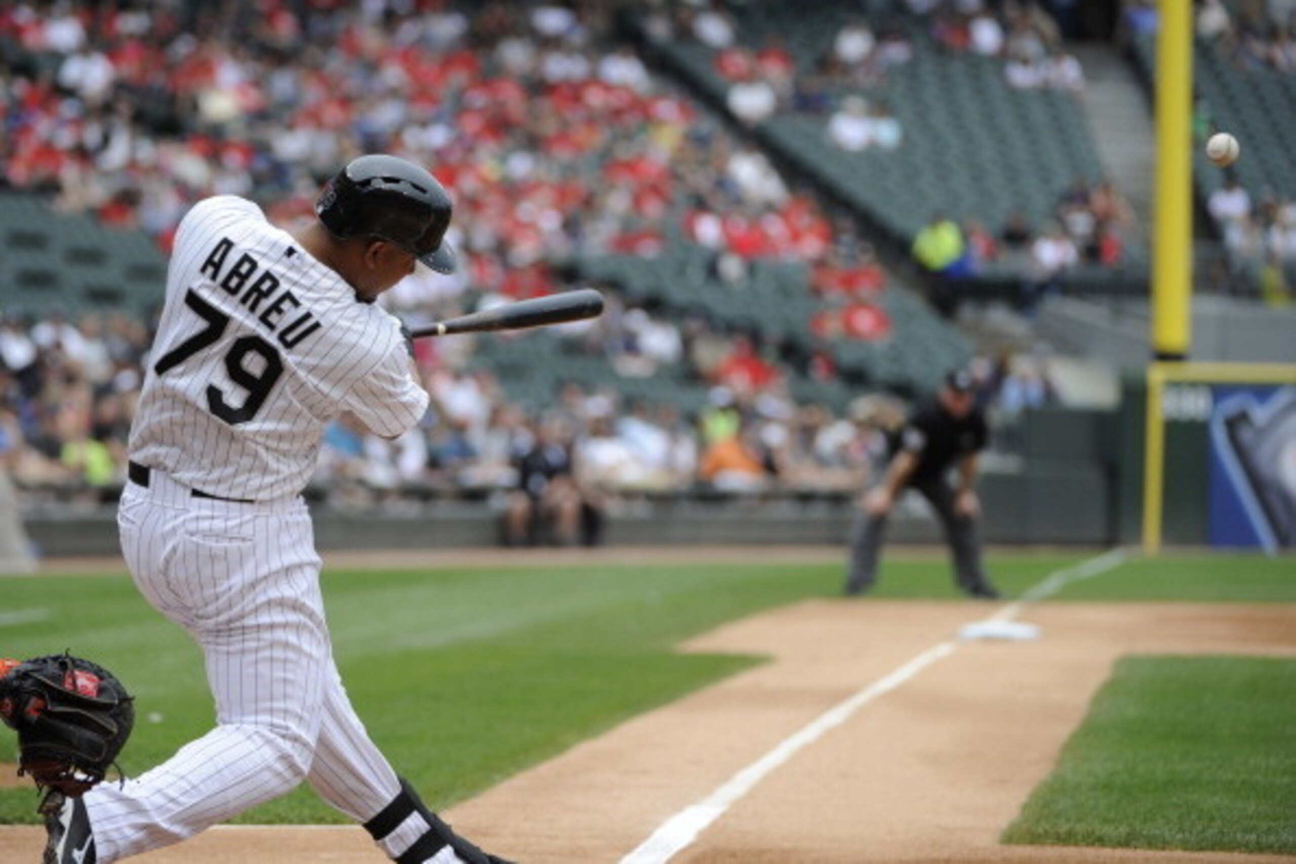 CHICAGO, IL - JUNE 18:  Jose Abreu #79 of the Chicago White Sox hits a two-run homer against the San Francisco Giants during the first inning on June 18,  2014 at U.S. Cellular Field in Chicago, Illinois. (Photo by David Banks/Getty Images)